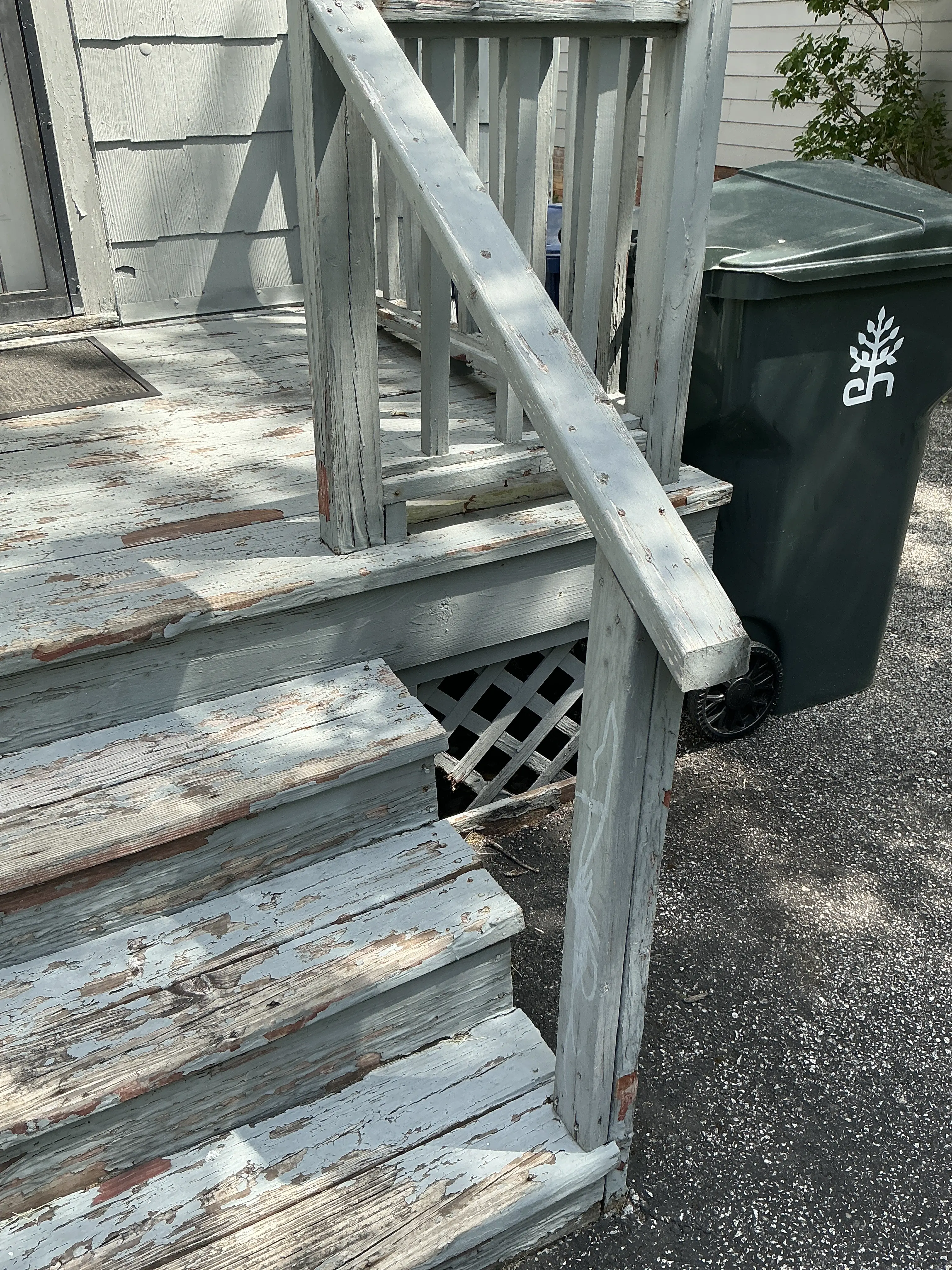 Peeling paint and weathered wood on exterior porch stairs during mold testing 2026-08-22