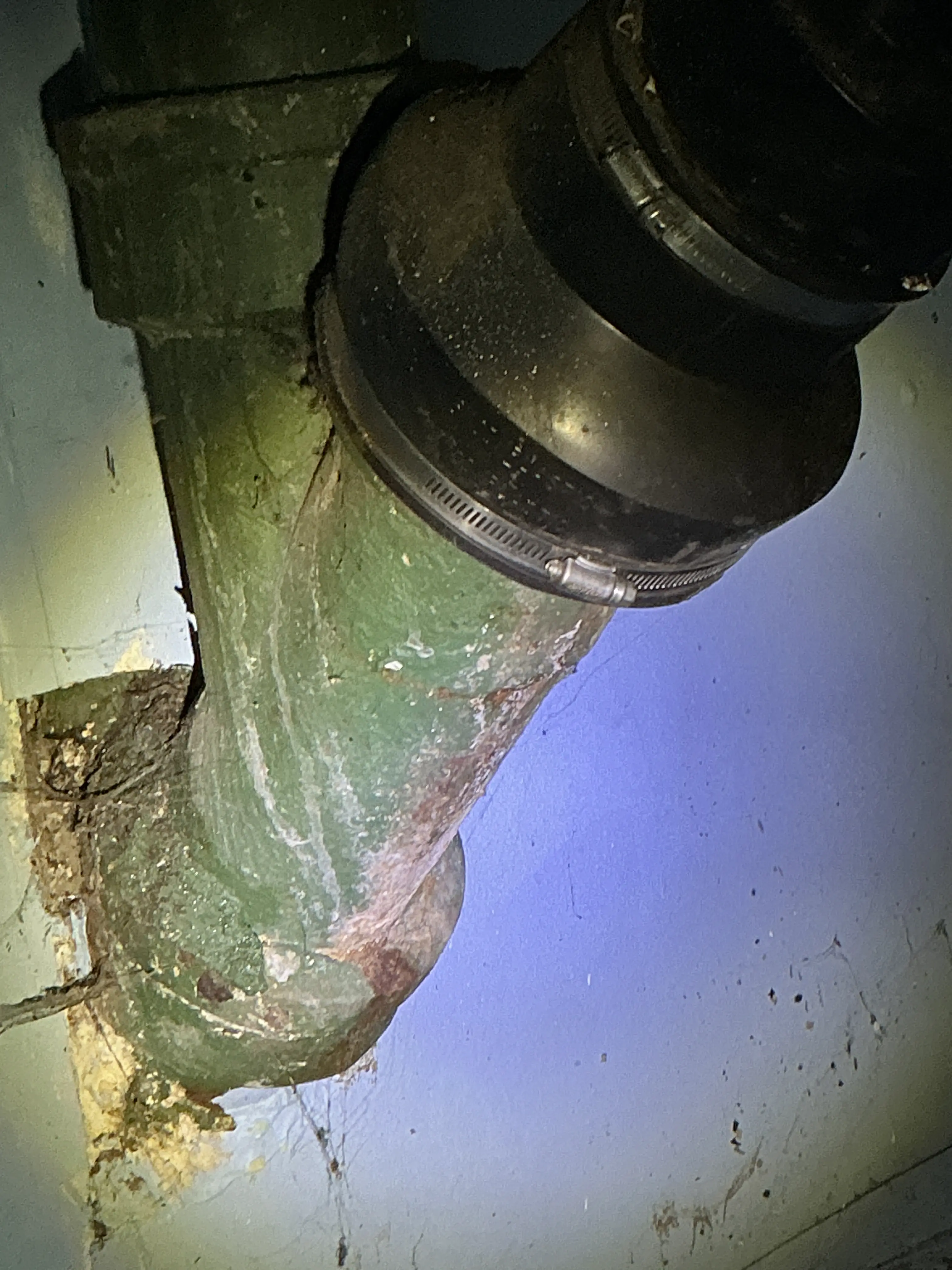 Corroded cast iron drain line with rubber boot coupling 2026-07-30
