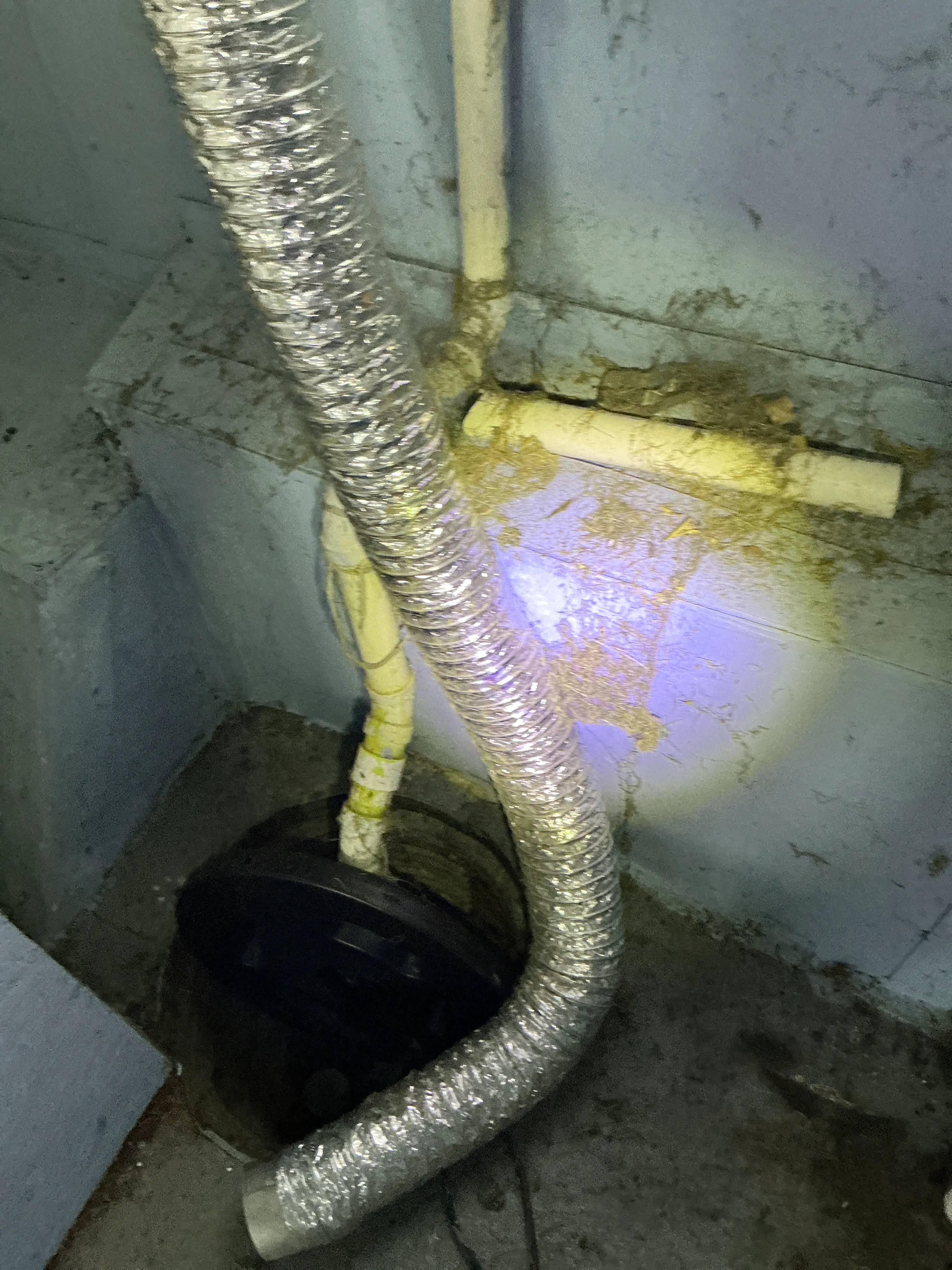 Flexible metal ducting improperly routed near PVC pipes in a crawlspace 2026-07-05