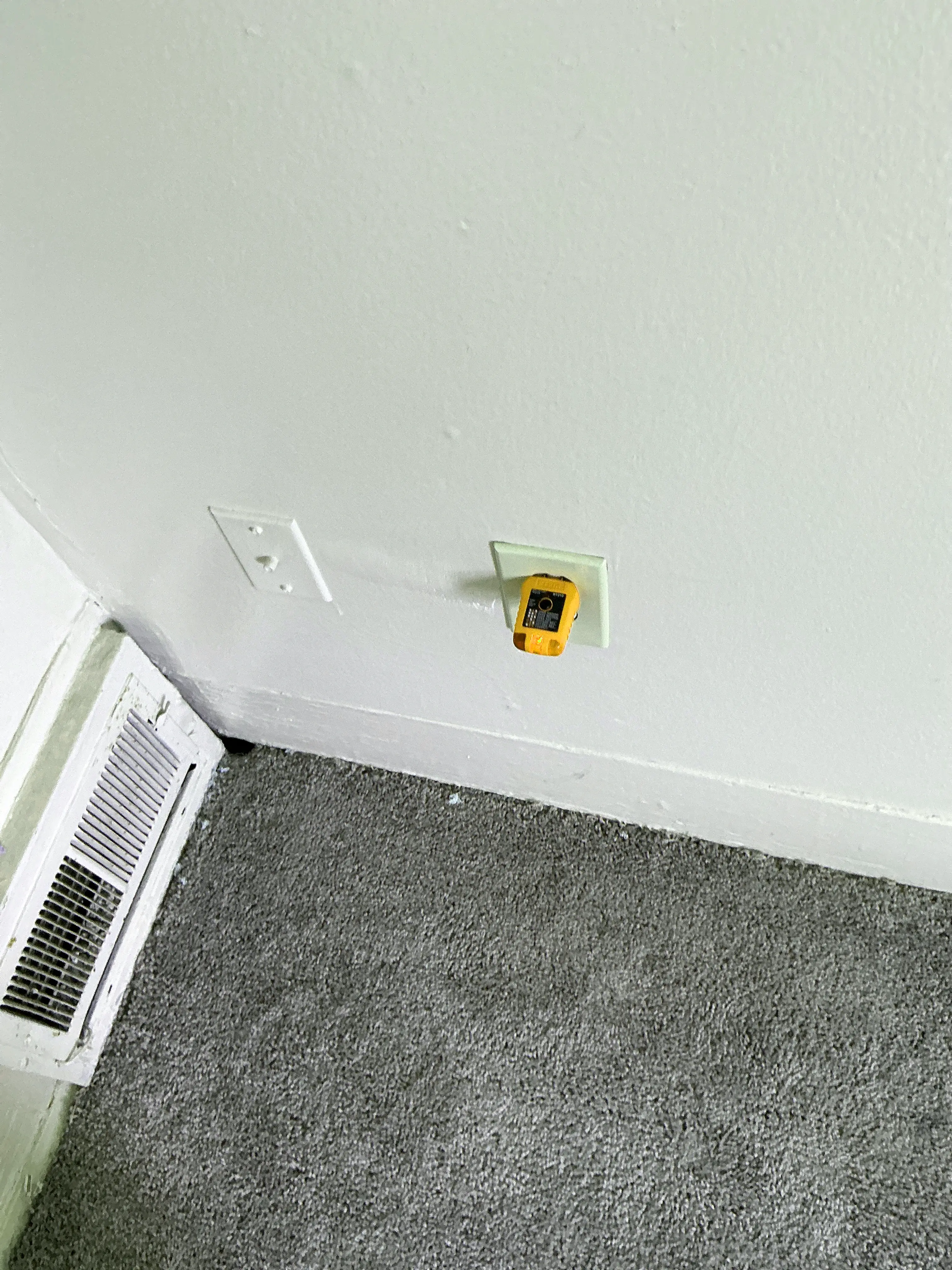 Receptacle tester plugged into a wall outlet during a home electrical inspection 2026-07-23