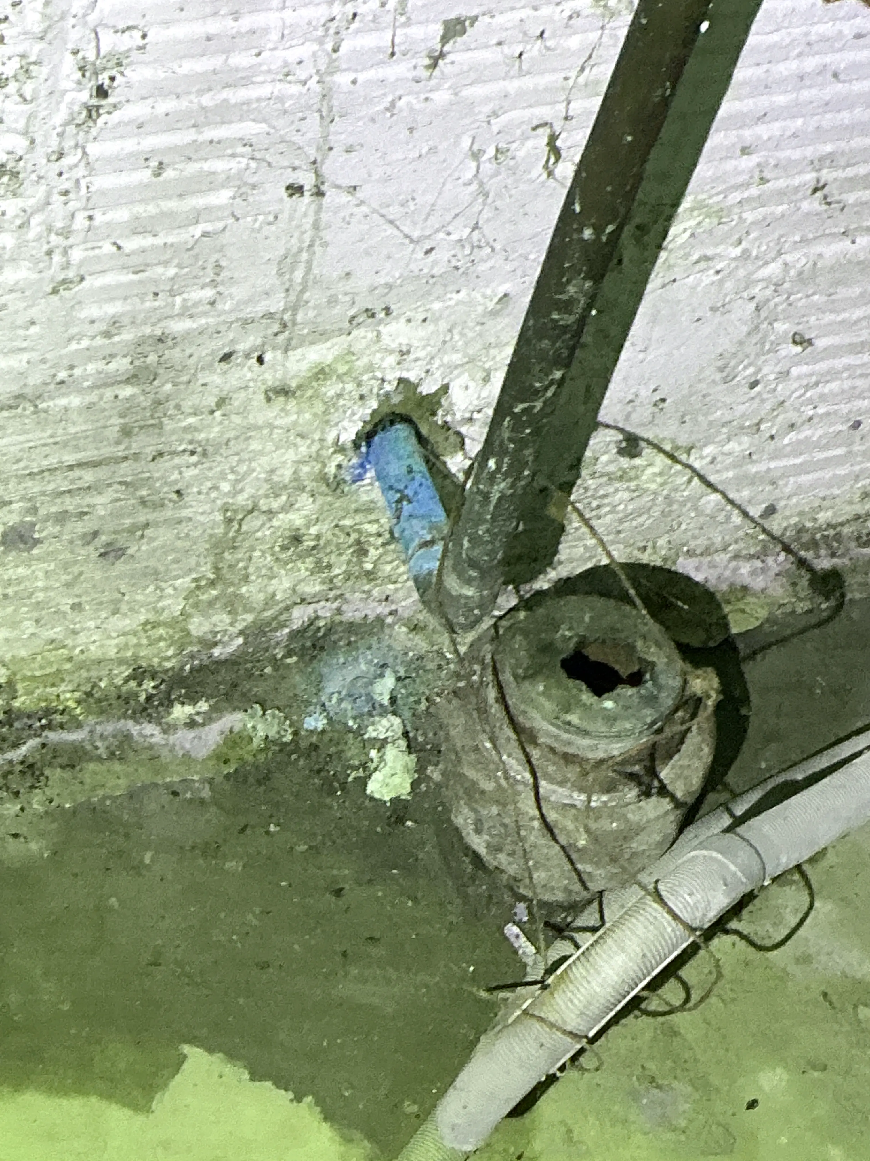 Corroded copper and metal plumbing pipe showing green oxidation and rust during home inspection 2026-07-04
