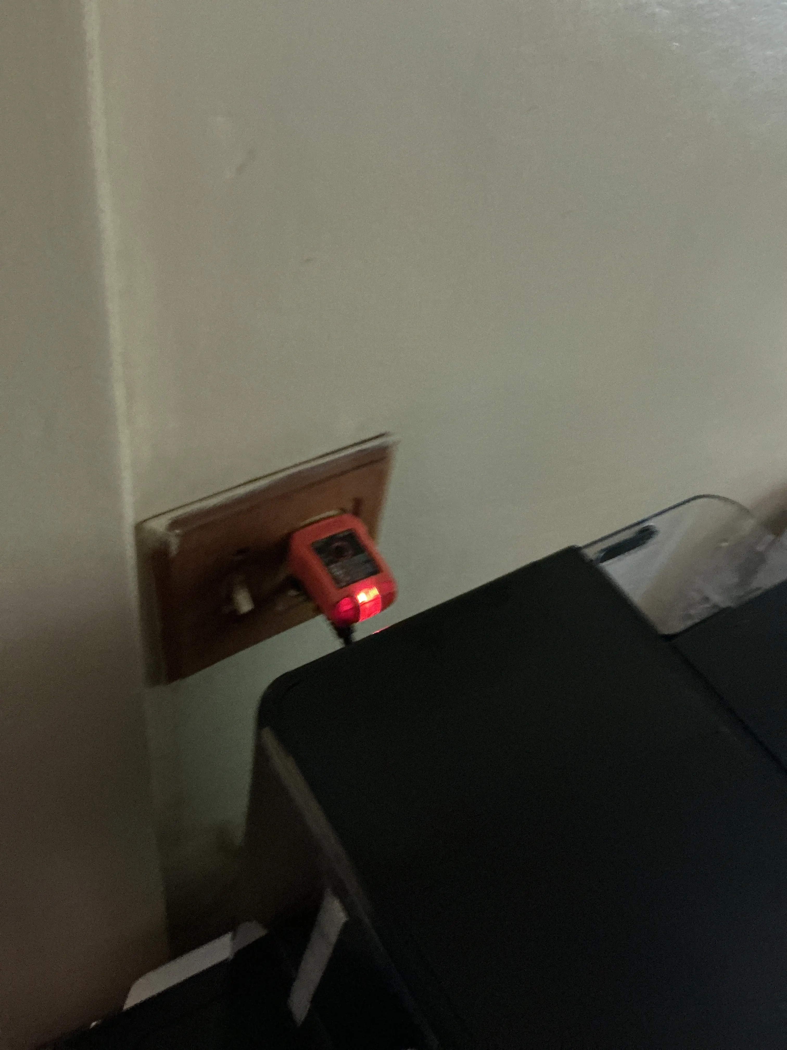 Electrical circuit tester plugged into a wall outlet during a home inspection 2026-07-13