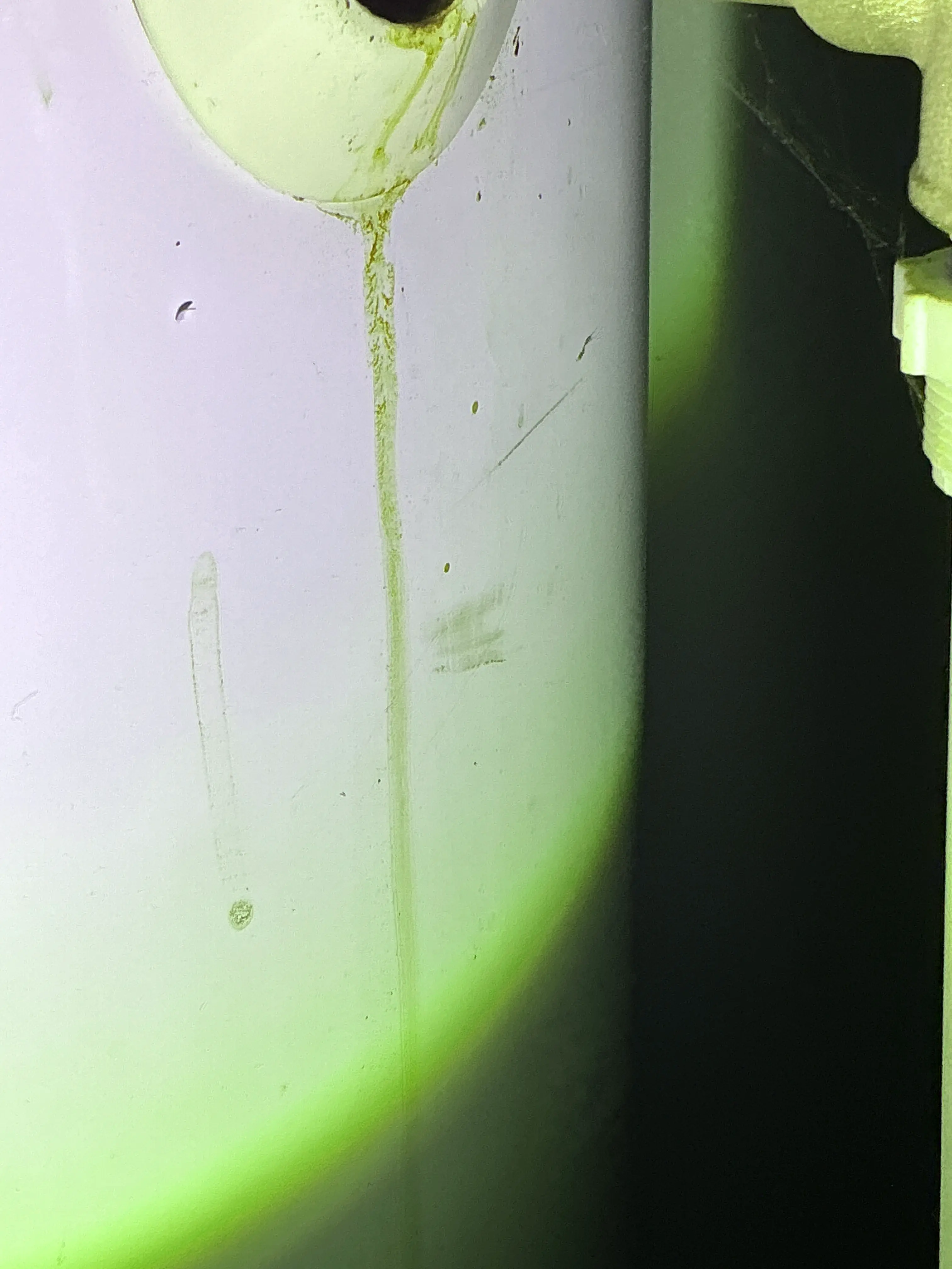 Water stain on the underside of a sink fixture indicating a plumbing leak 2026-08-27