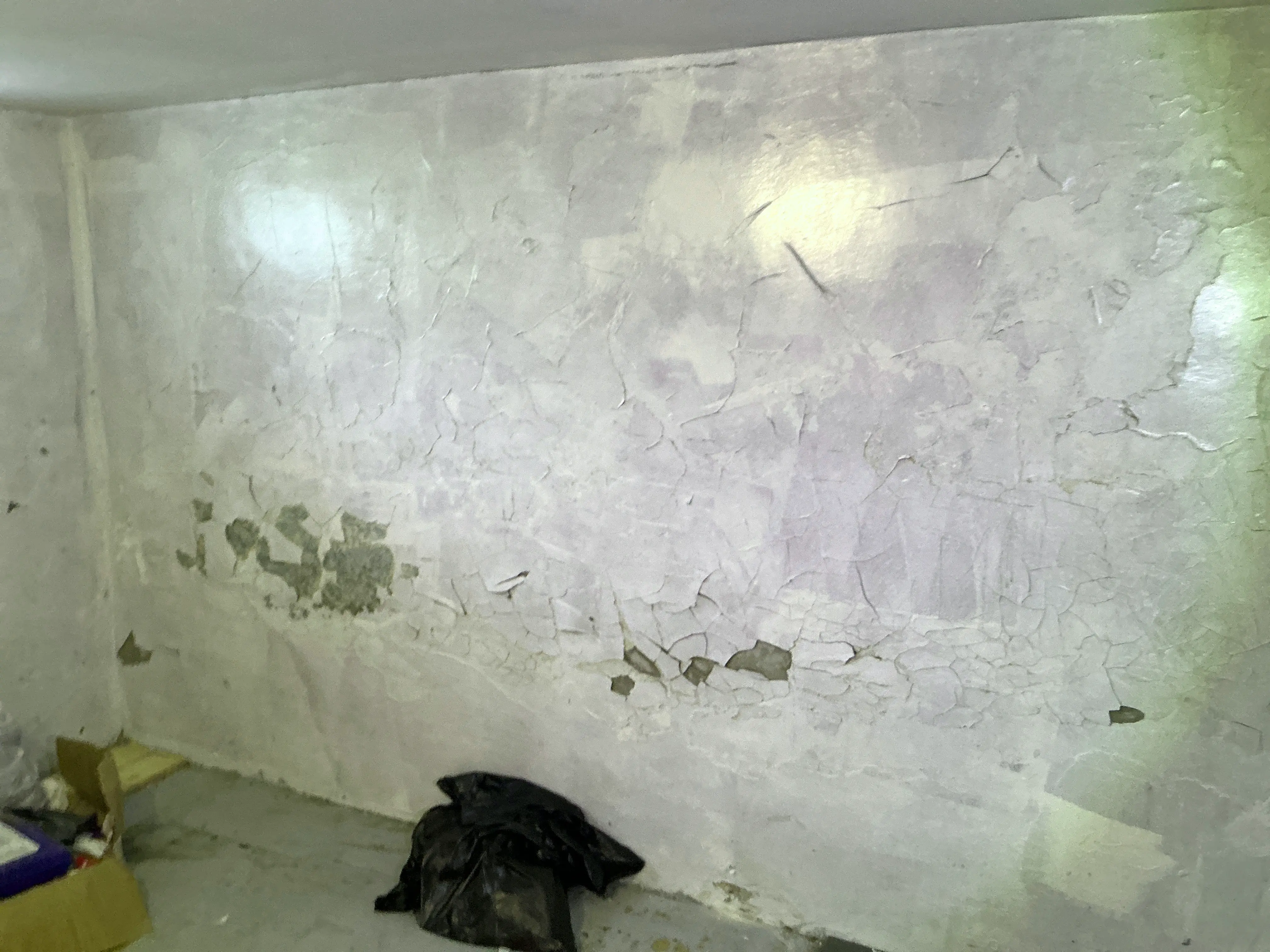 Severe interior wall moisture damage with peeling paint and cracked plaster 2026-08-27