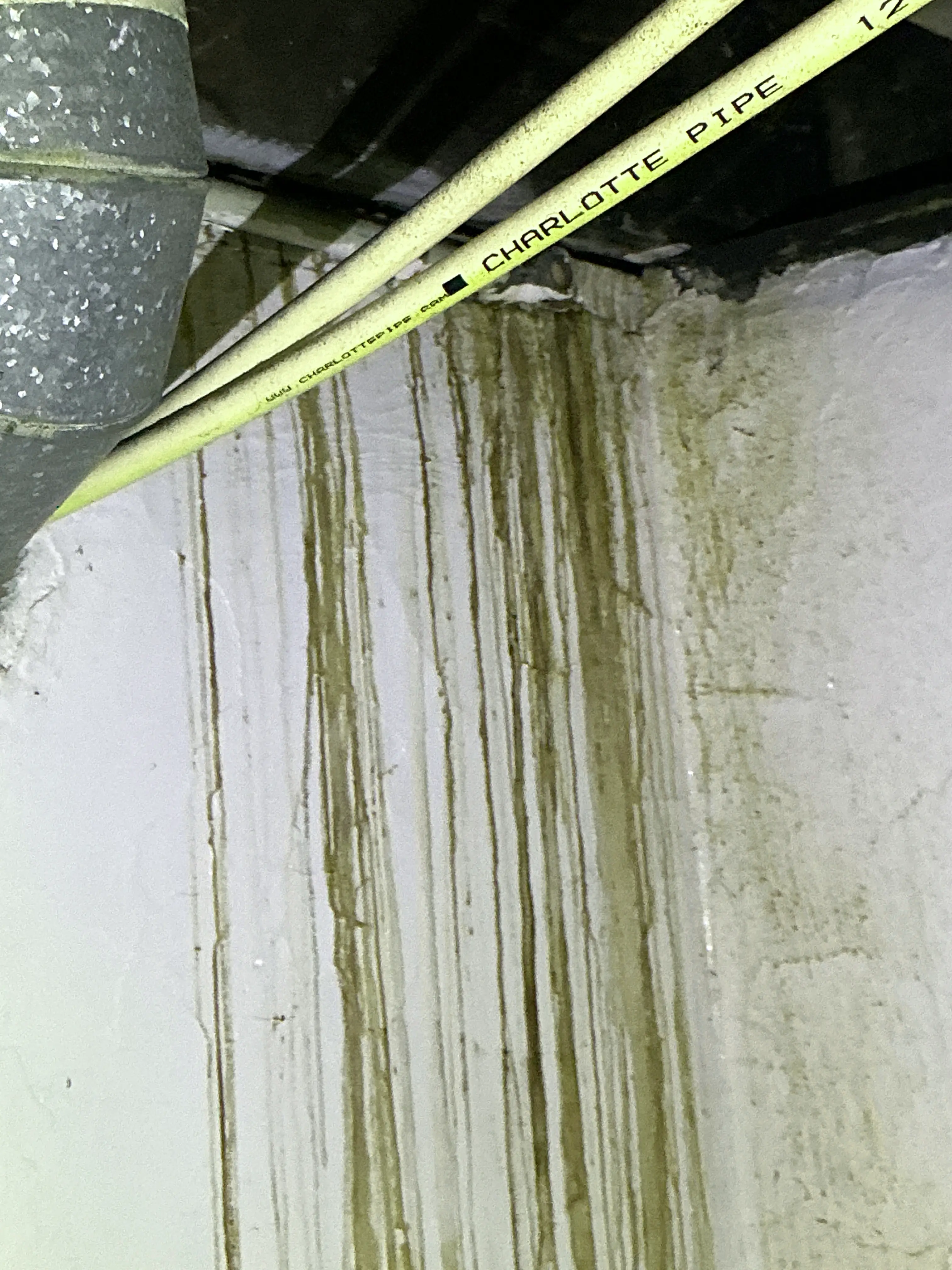 Water staining and moisture damage on ceiling joists near plumbing pipes 2026-08-09