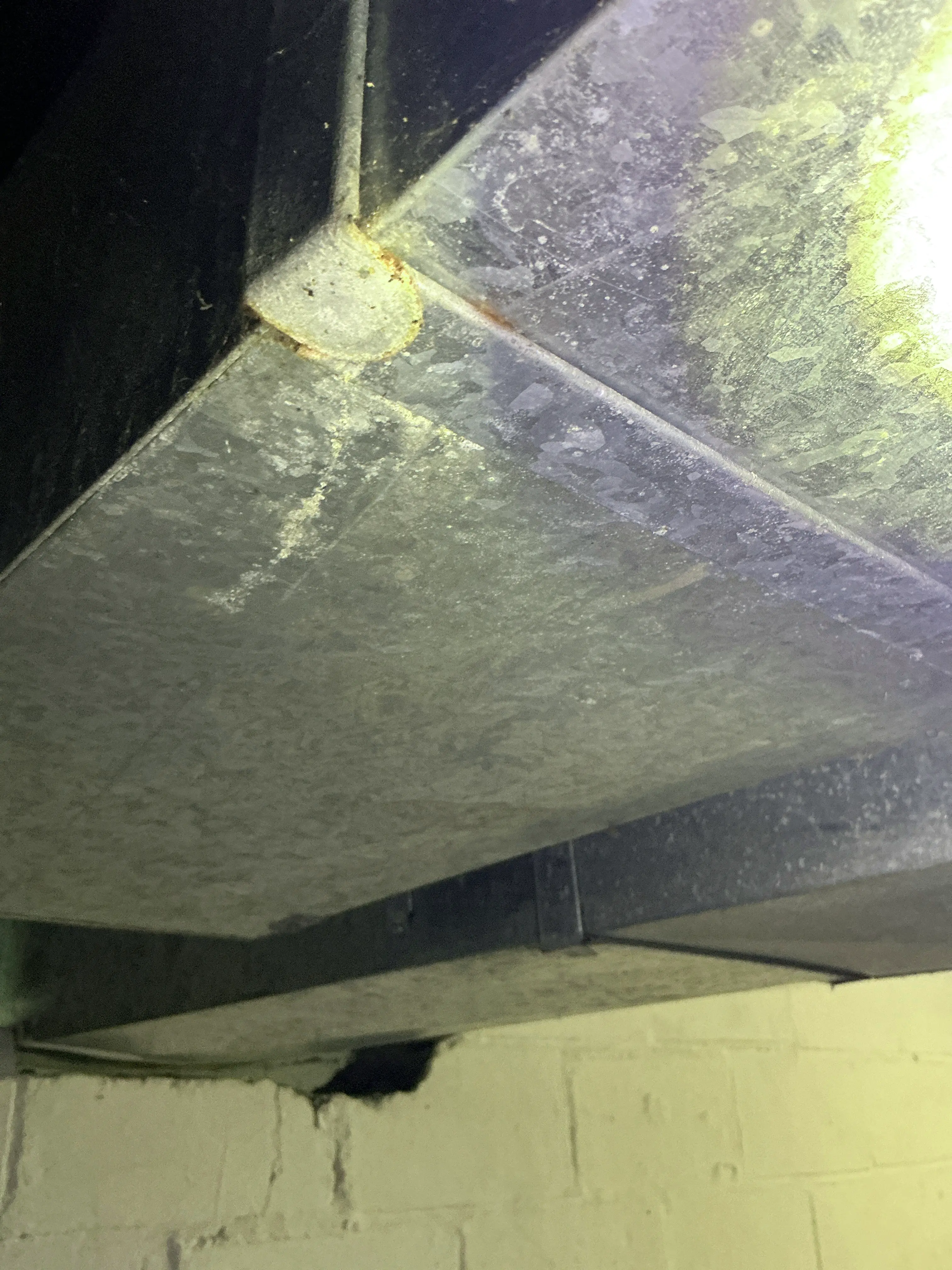 Surface rust and corrosion on galvanized sheet metal HVAC ductwork seam 2026-08-01