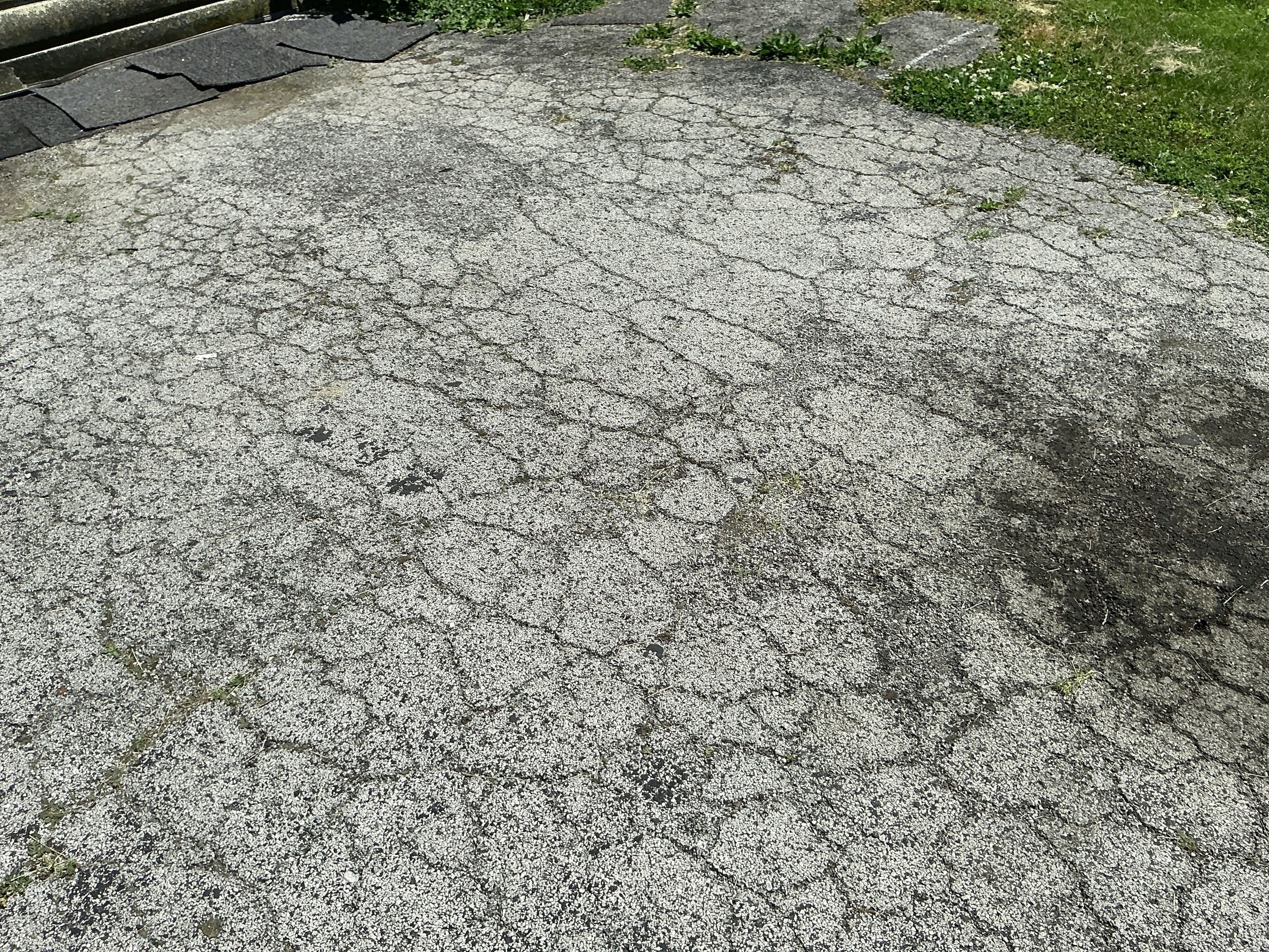 Severely cracked and deteriorated asphalt pavement requiring maintenance or repaving 2026-08-08