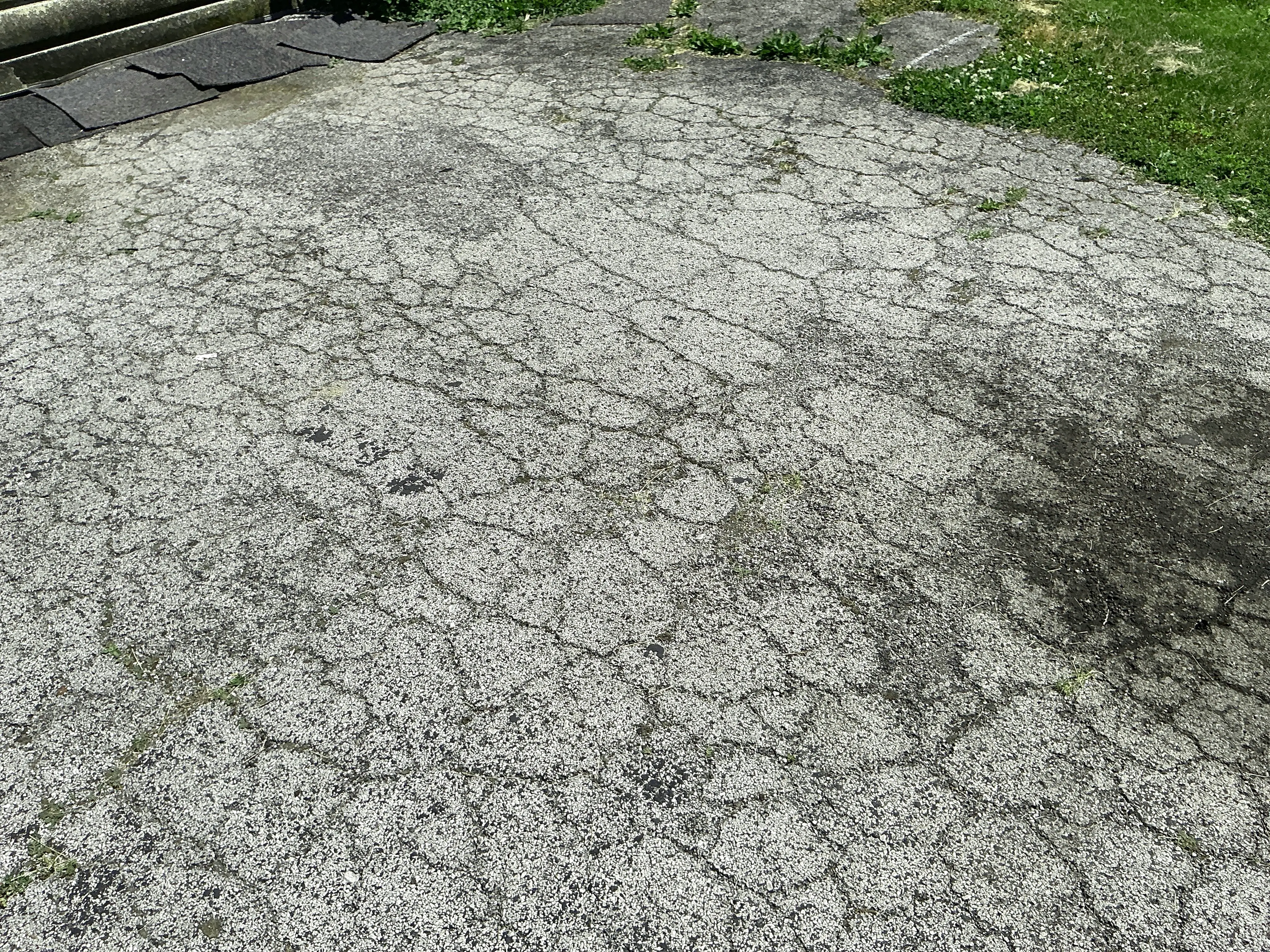 Severely cracked and deteriorated asphalt pavement requiring maintenance or repaving 2026-08-28