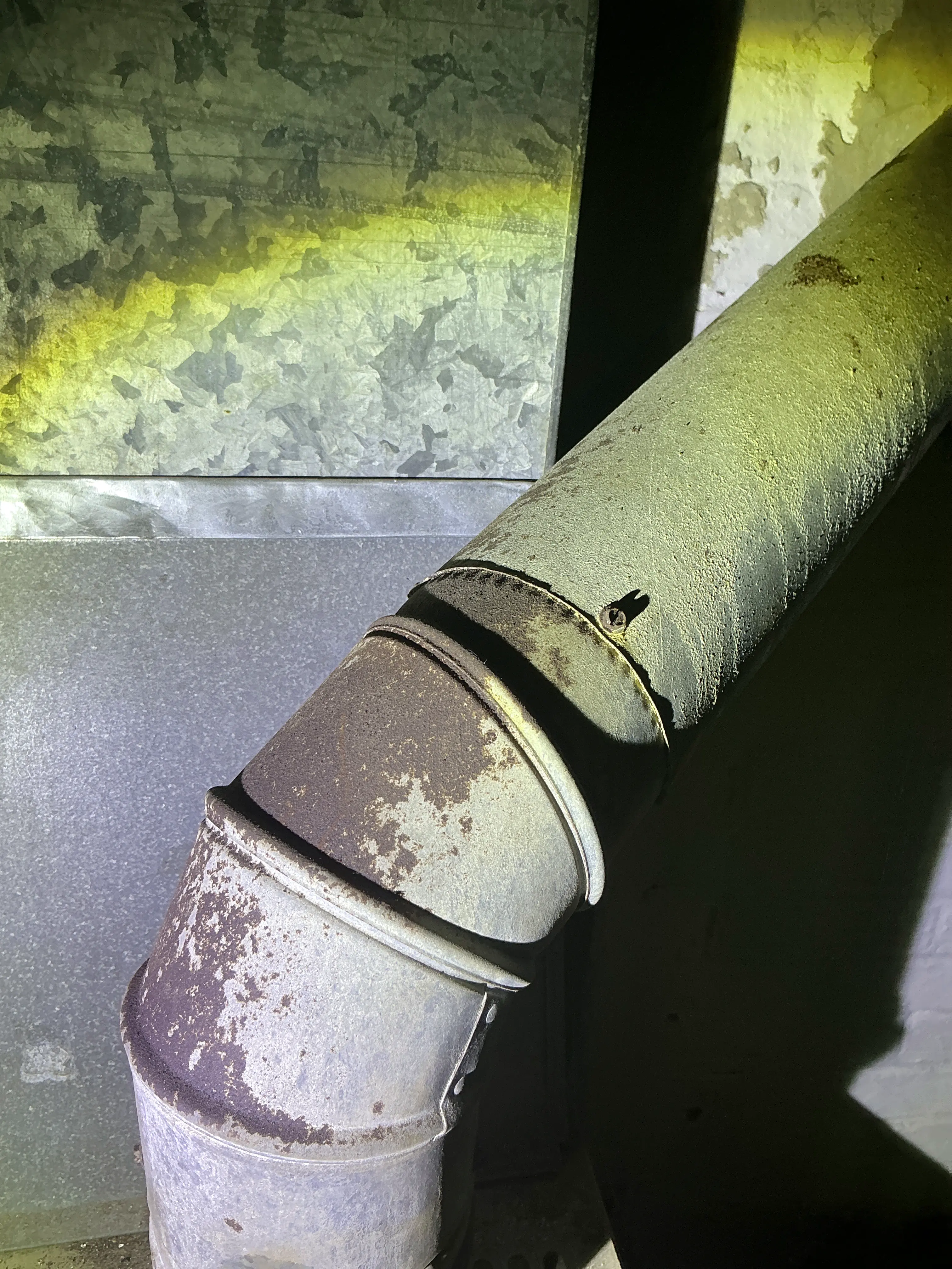 Corroded and disconnected flue pipe in HVAC system during home inspection 2026-08-17