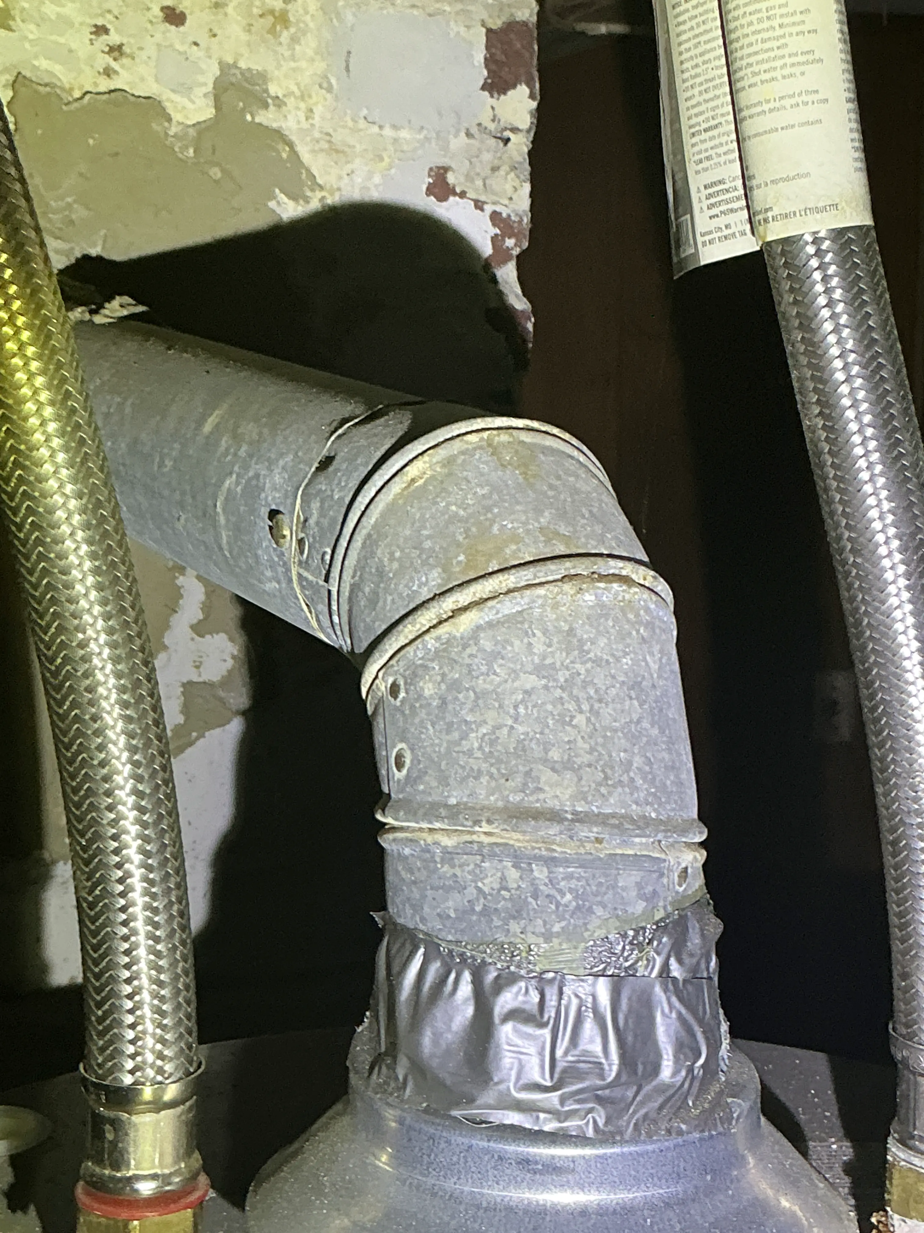 Gas water heater metal flue pipe elbow sealed with foil tape 2026-08-30