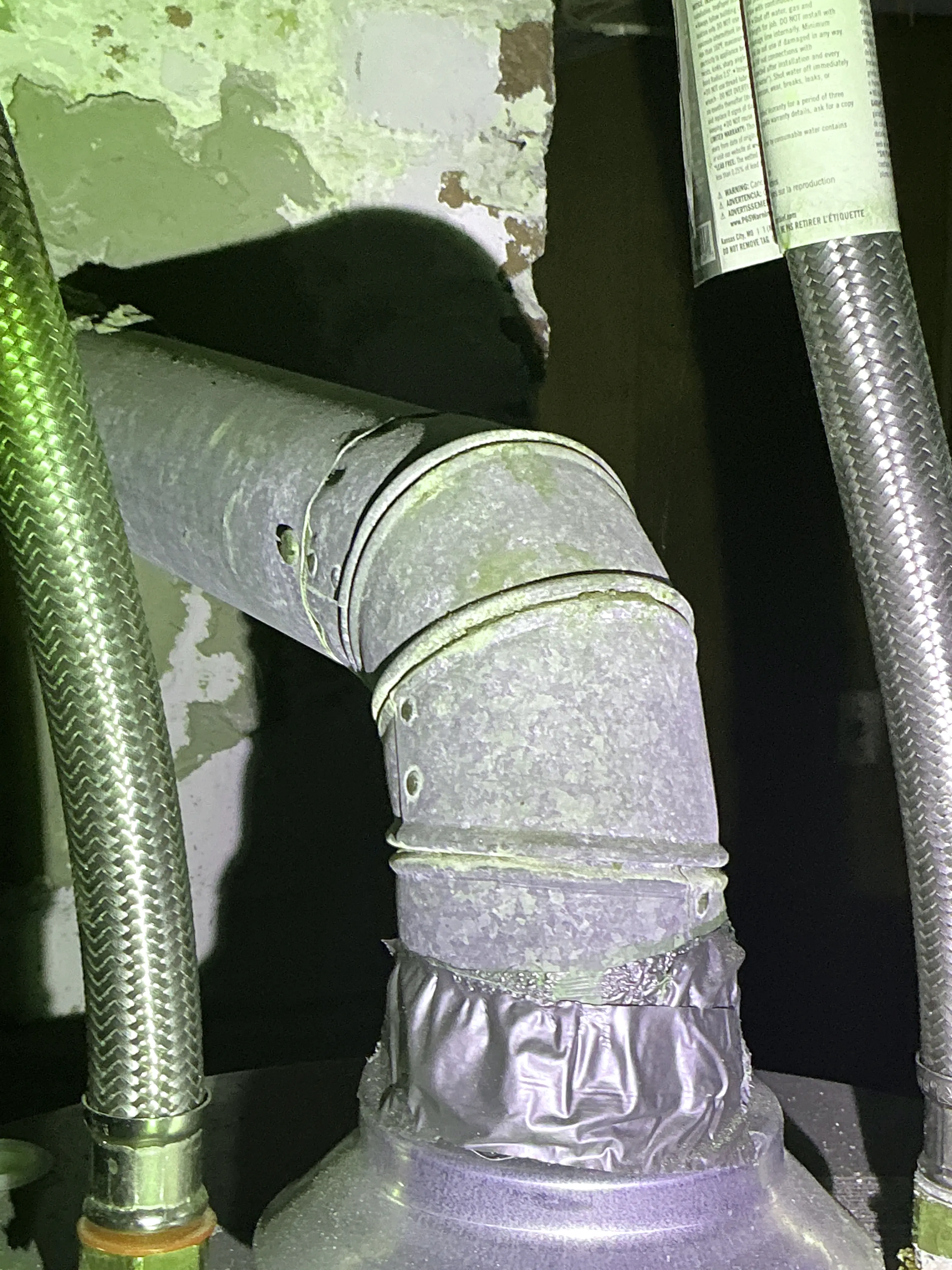 Gas water heater metal flue pipe elbow sealed with foil tape 2026-08-26