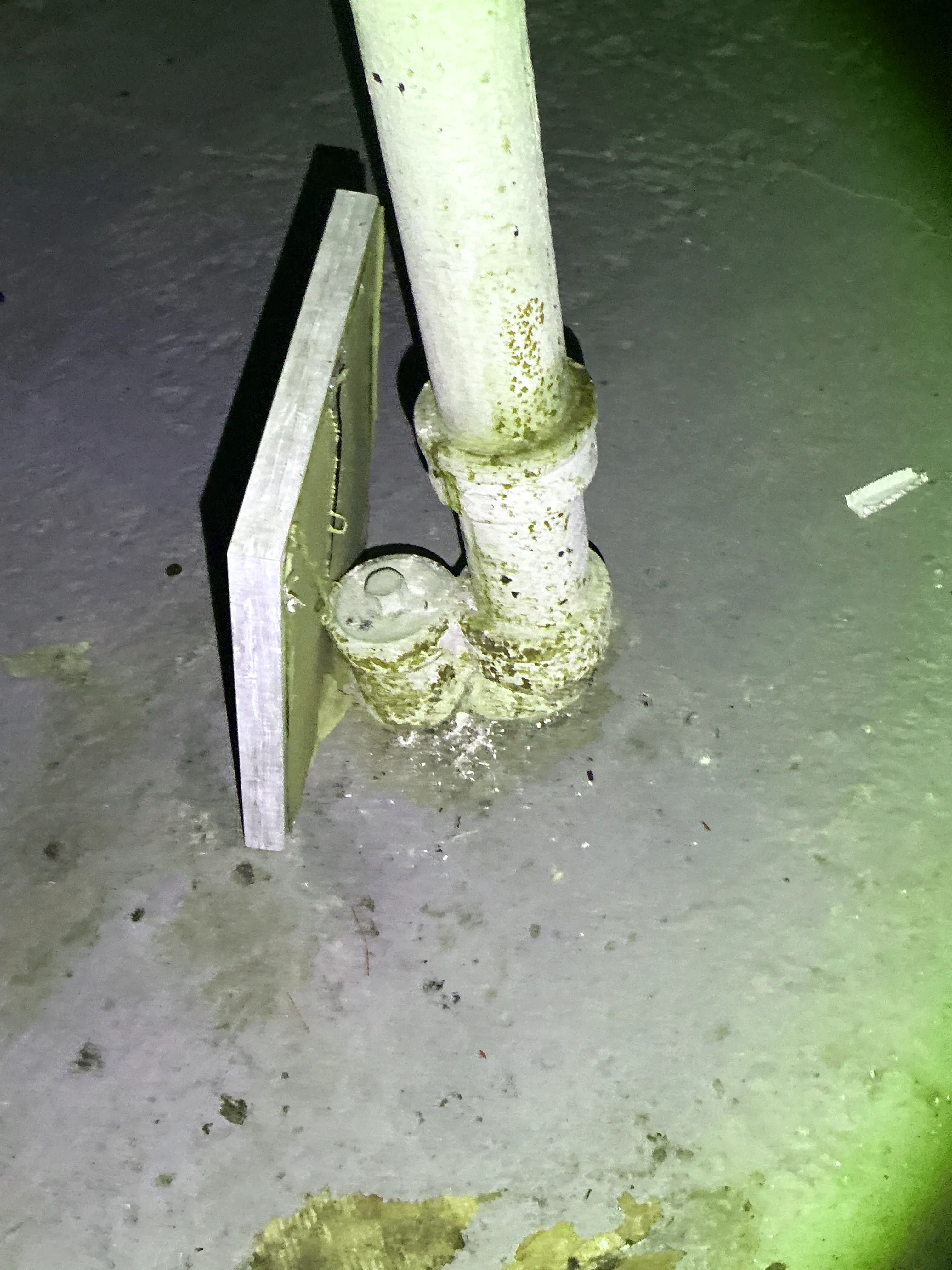 Corroded metal pipe fitting with rust in basement 2026-08-19