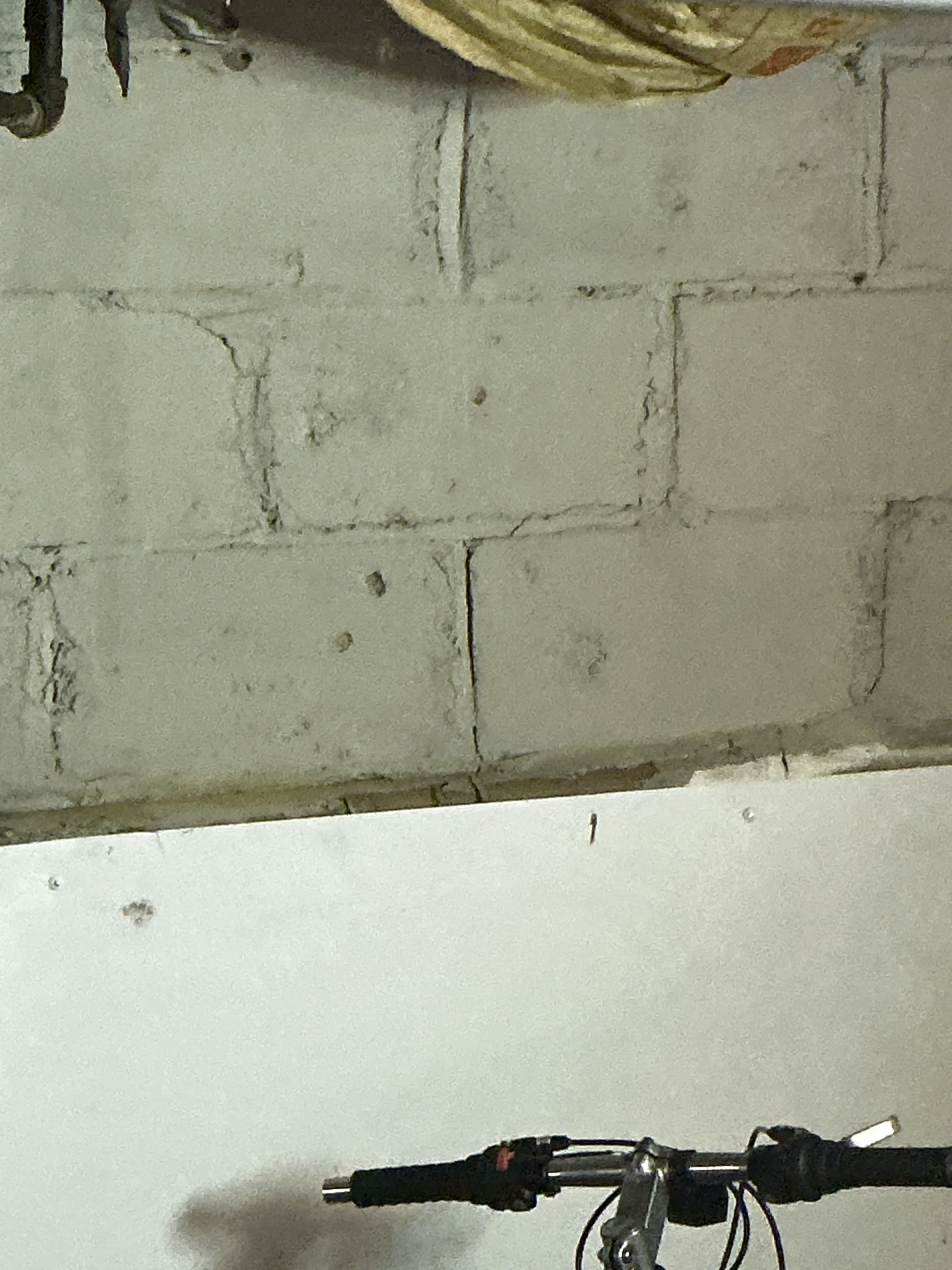 Cracked mortar joints on a concrete block foundation wall 2026-08-29