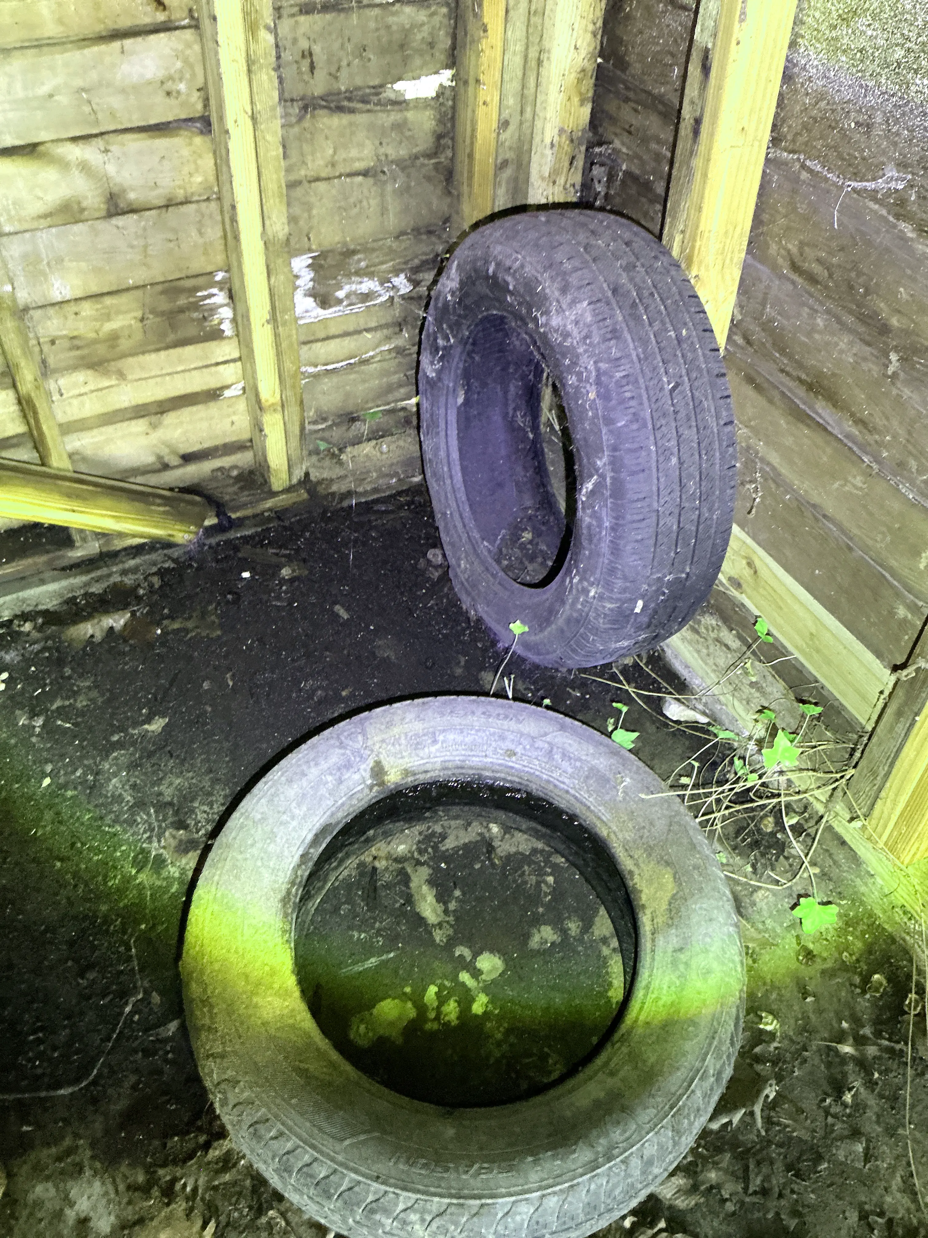 Abandoned car tires stored in a dirty crawlspace 2026-08-09