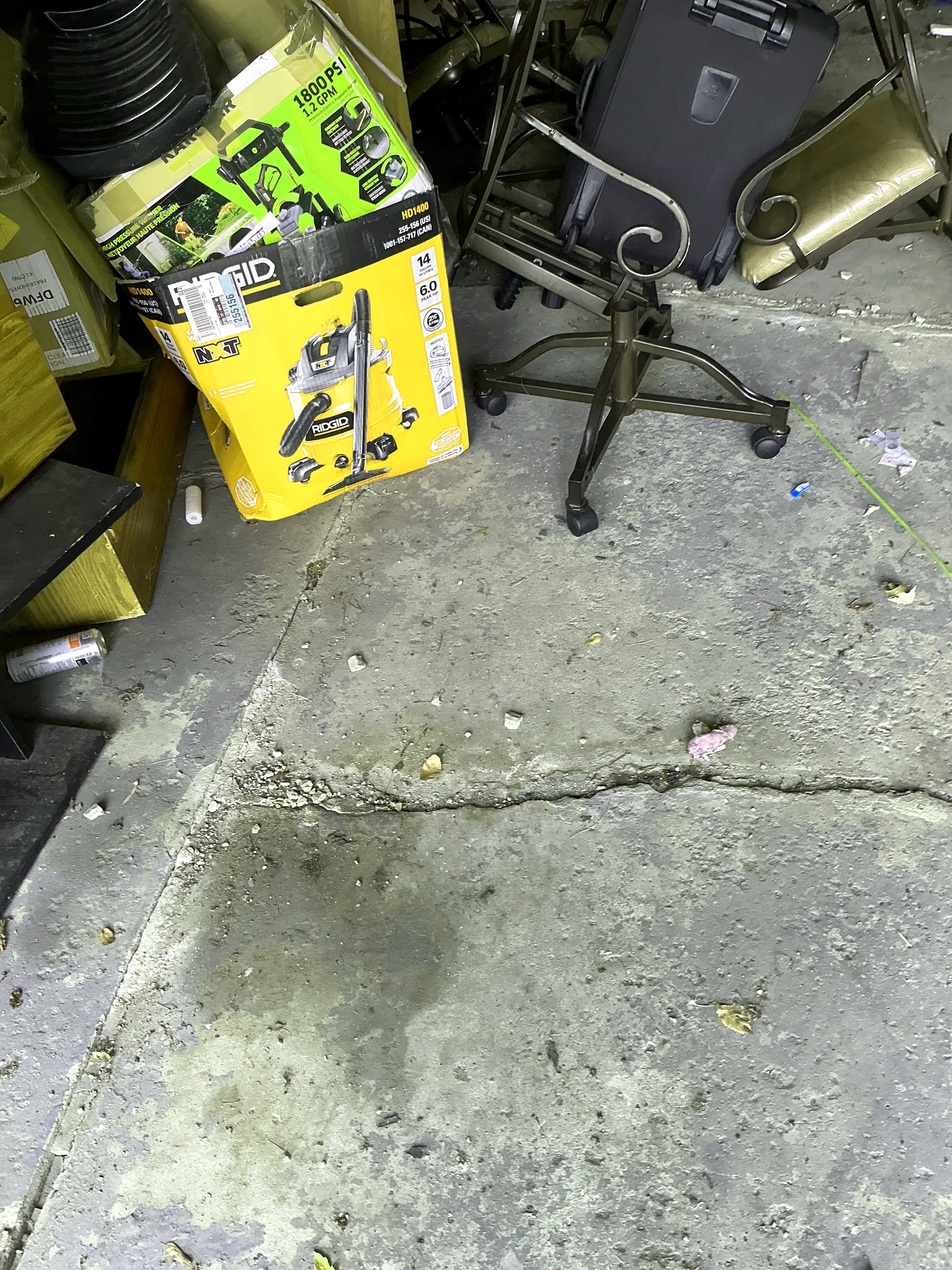 Cracked concrete garage slab showing signs of foundation or floor movement 2026-07-11