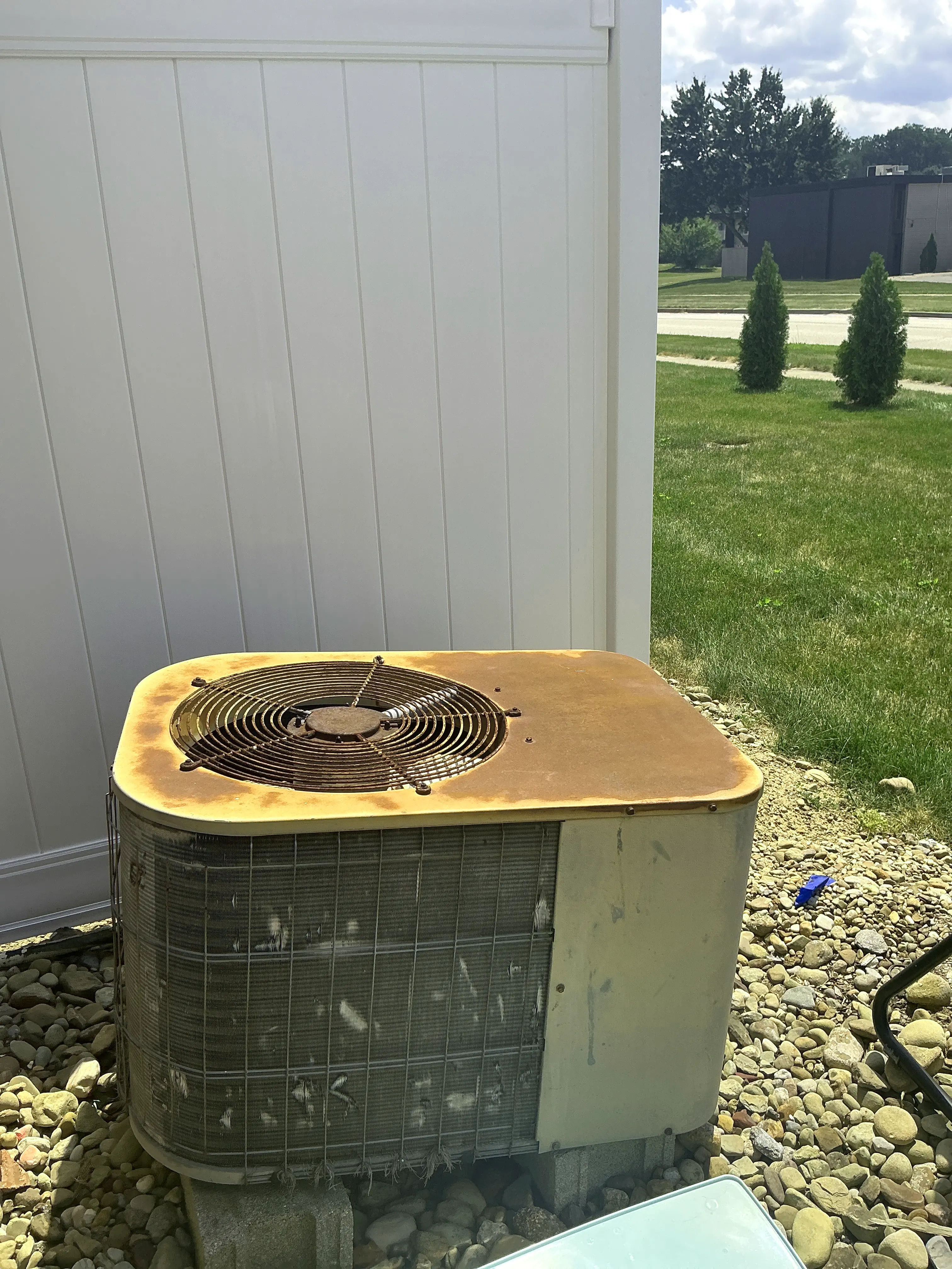Rusted outdoor air conditioner unit showing severe corrosion during home inspection 2026-07-18