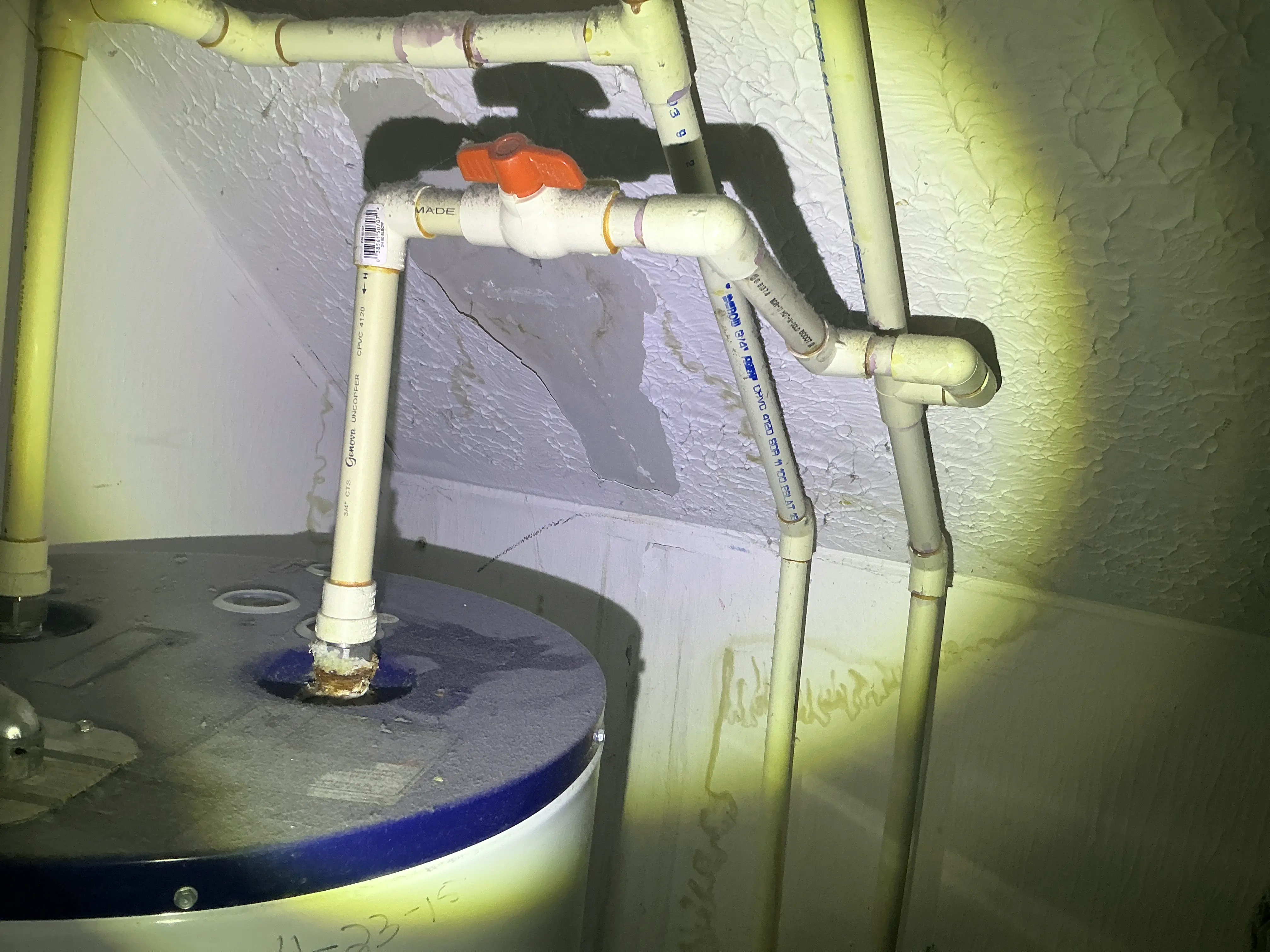 Corrosion on water heater pipe connection with ceiling water damage during mold testing 2026-07-25