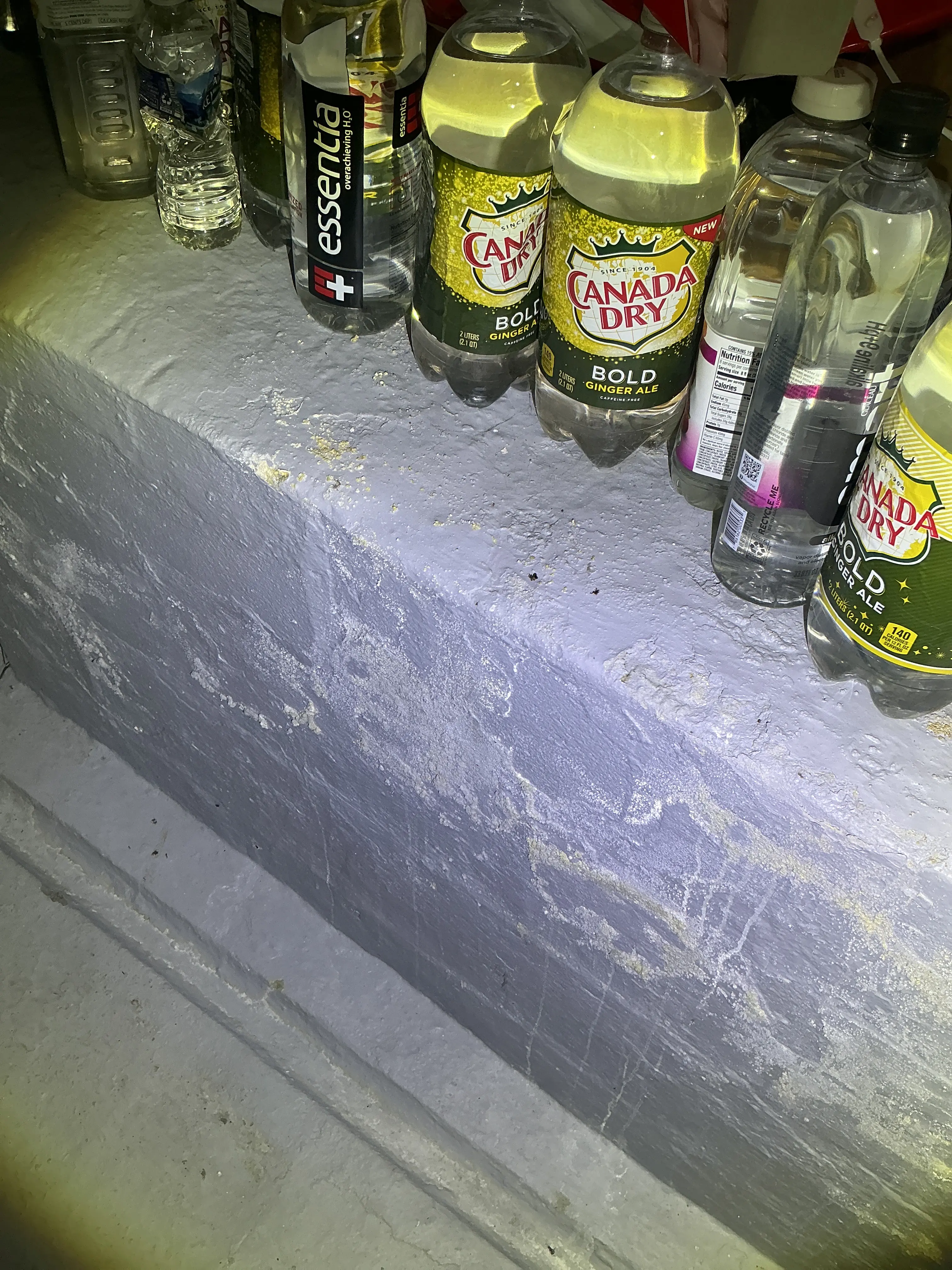 Efflorescence and flaking paint on basement masonry wall from moisture penetration 2026-08-09