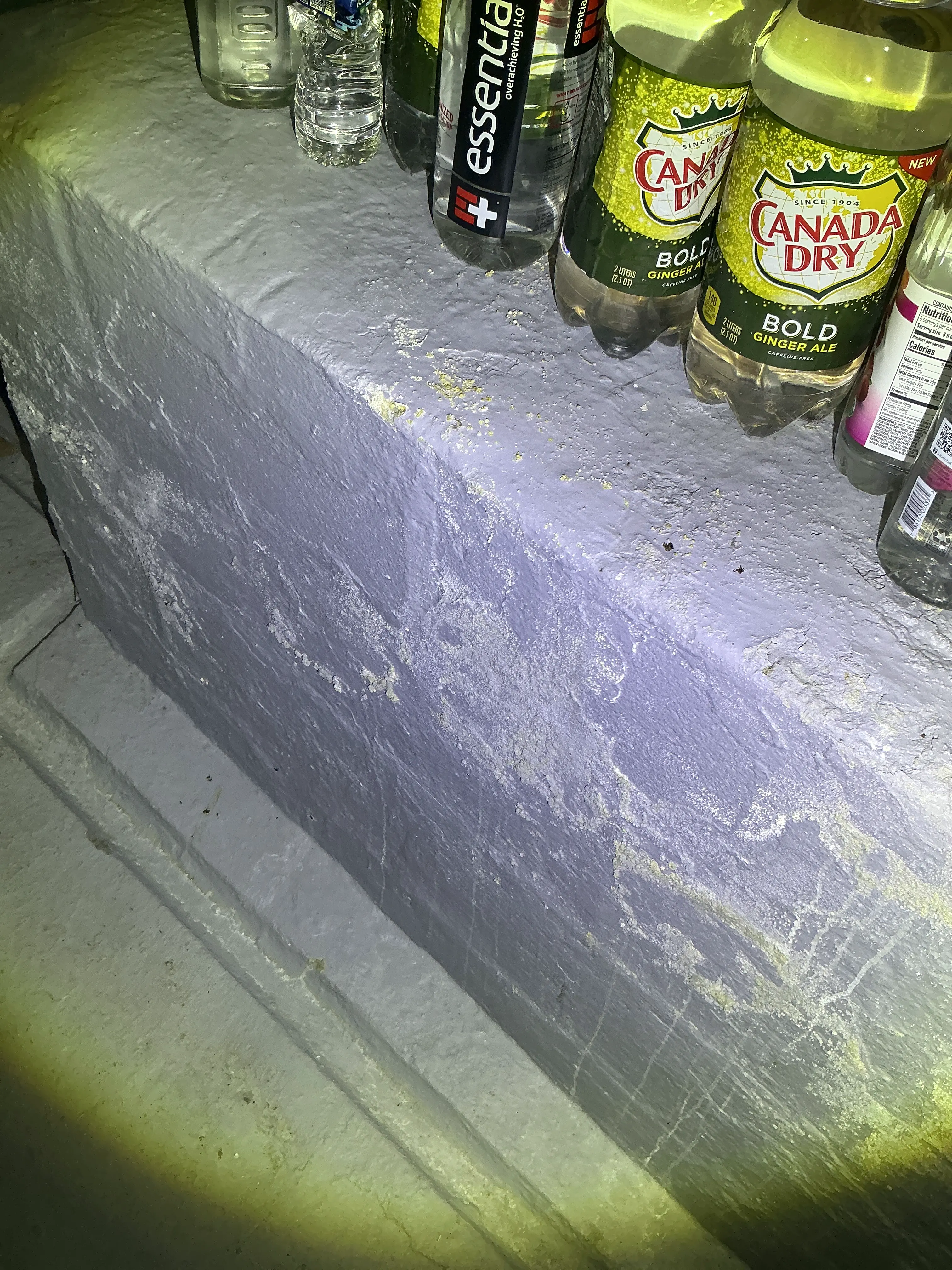 Efflorescence and moisture damage on painted basement foundation wall 2026-08-12