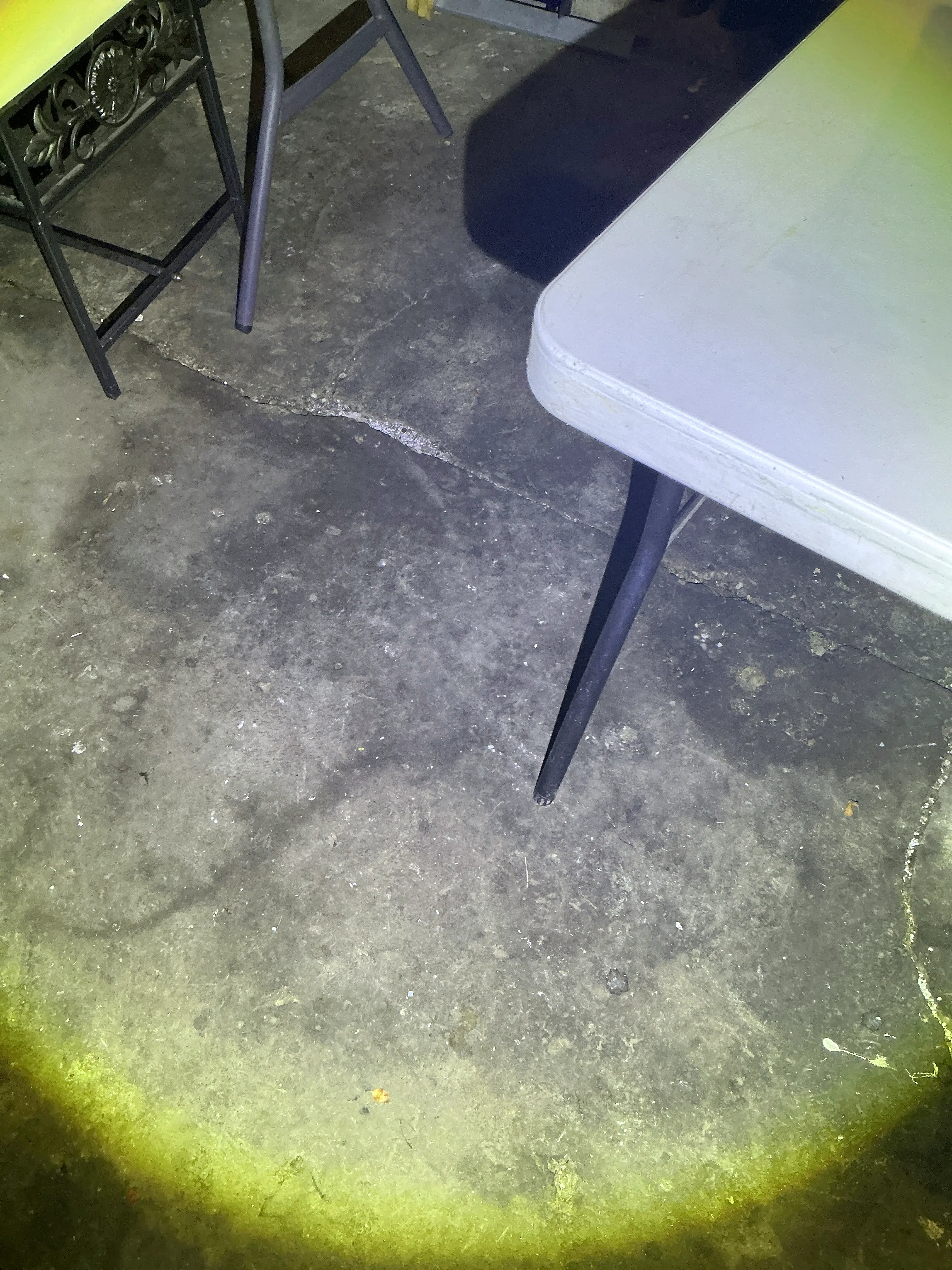 Crack in concrete slab floor illuminated during lead test 2026-08-16