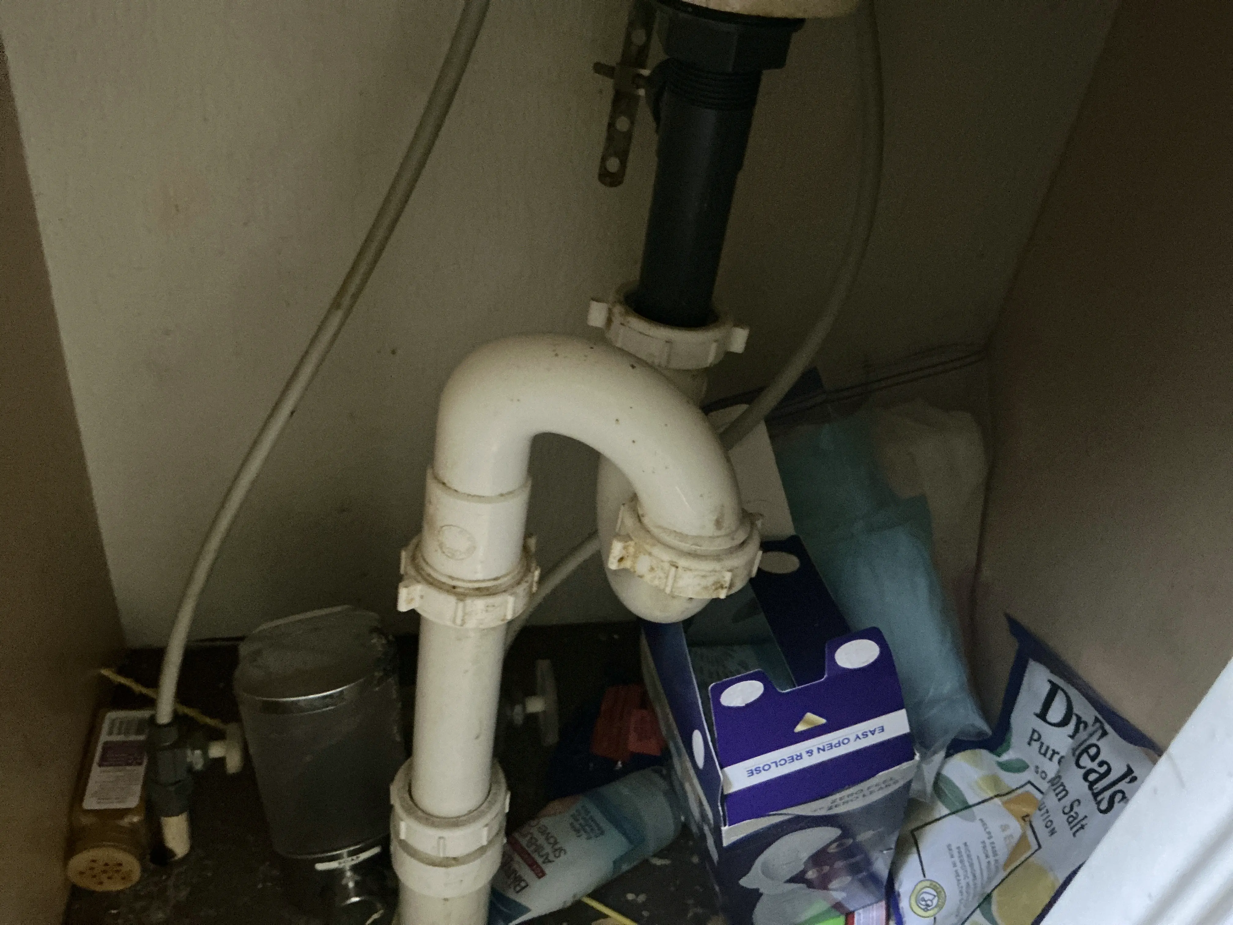 Improper S-trap plumbing configuration underneath a sink 2026-07-30