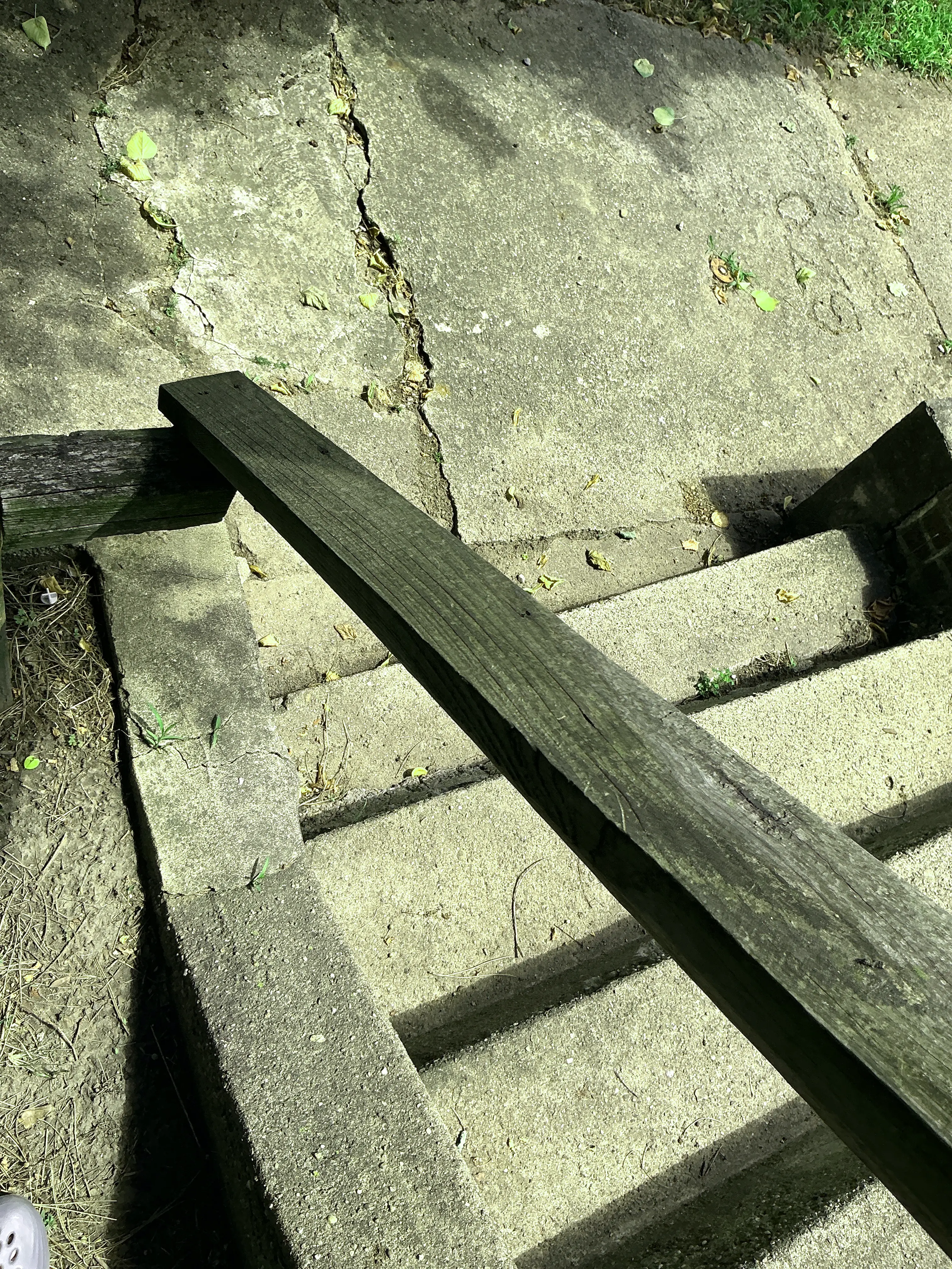 Cracked concrete stairs and walkway inspected for exterior safety hazards 2026-08-15