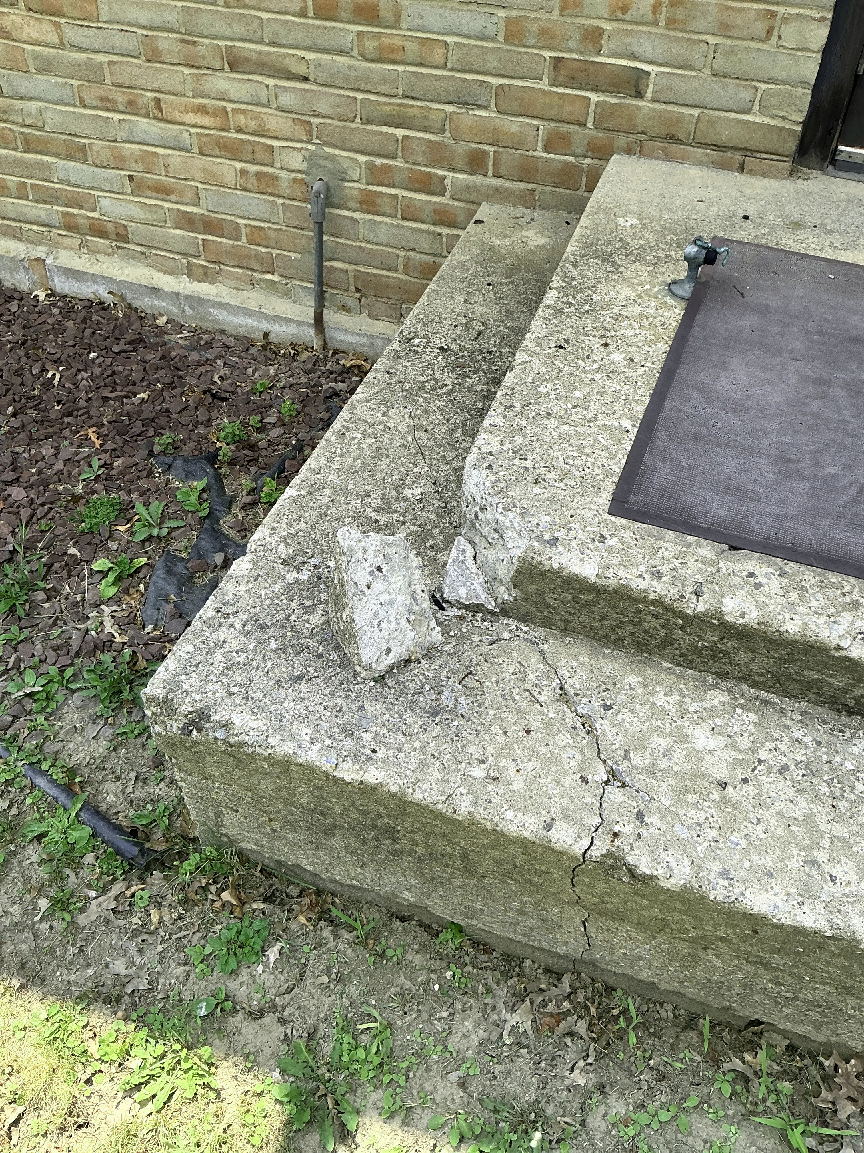 Cracked and broken exterior concrete steps needing masonry repair 2026-07-29