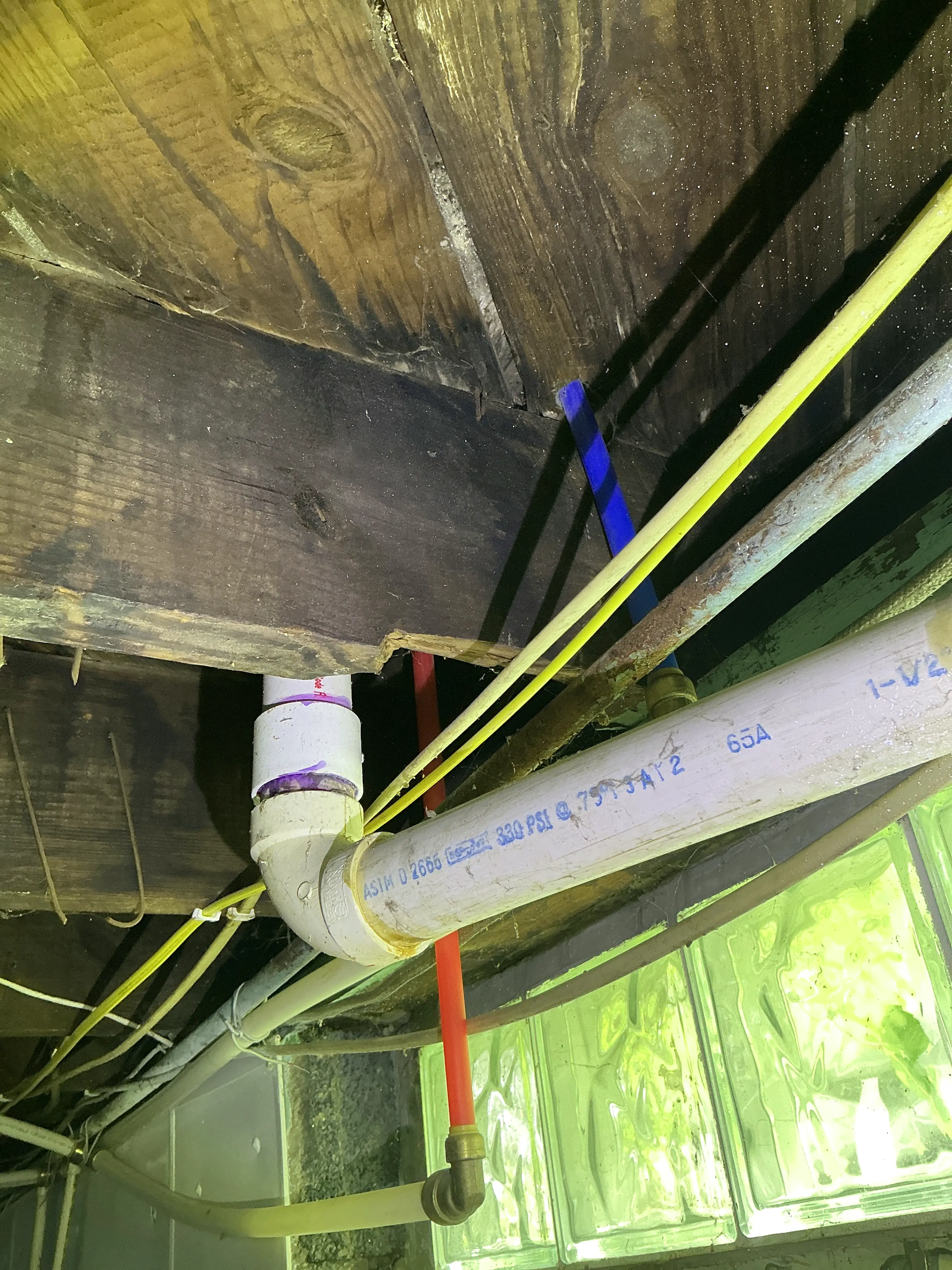 Excessively notched floor joist for PVC pipe and plumbing installation 2026-07-15
