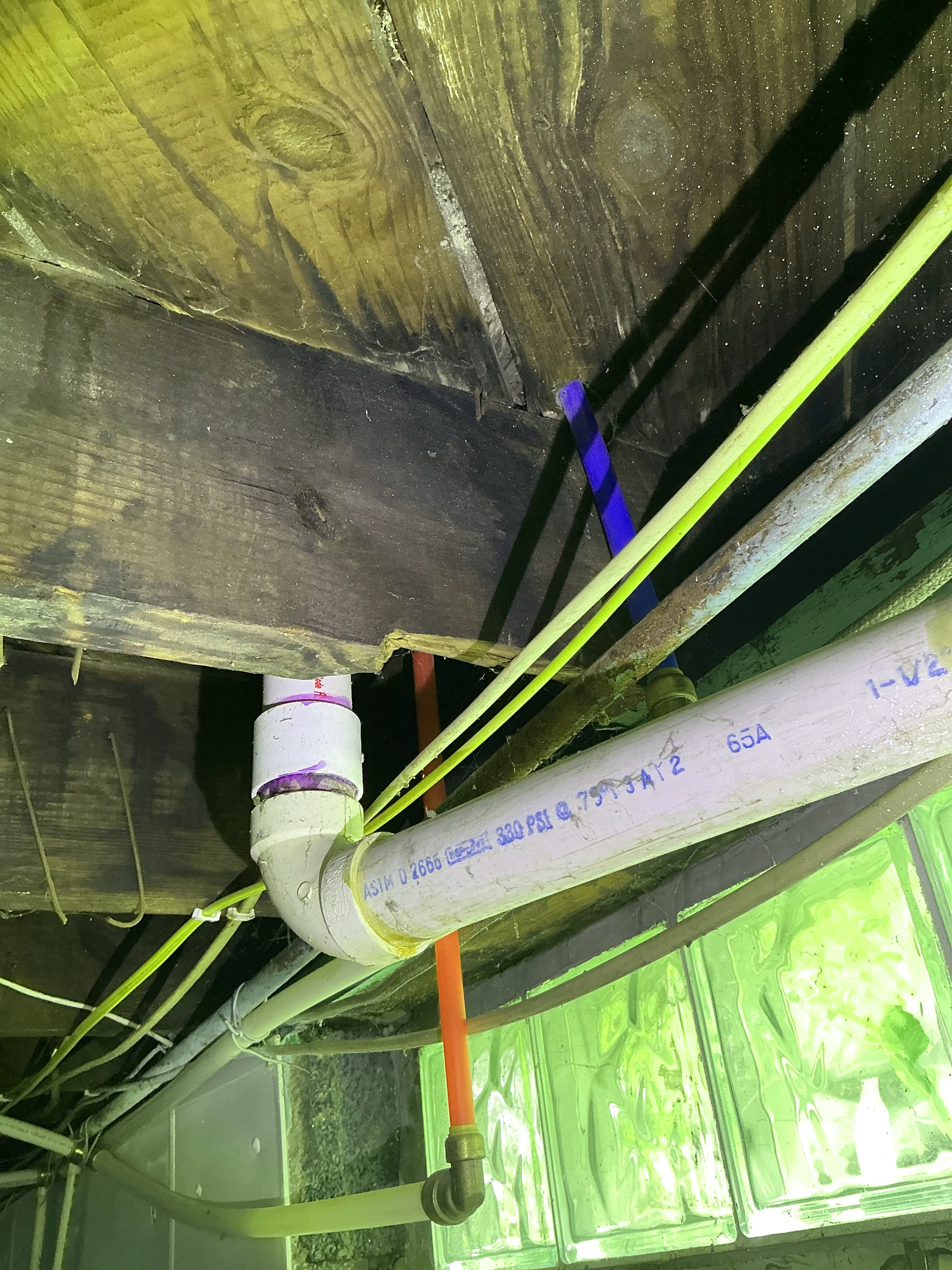 Excessively notched floor joist for PVC pipe and plumbing installation 2026-08-23