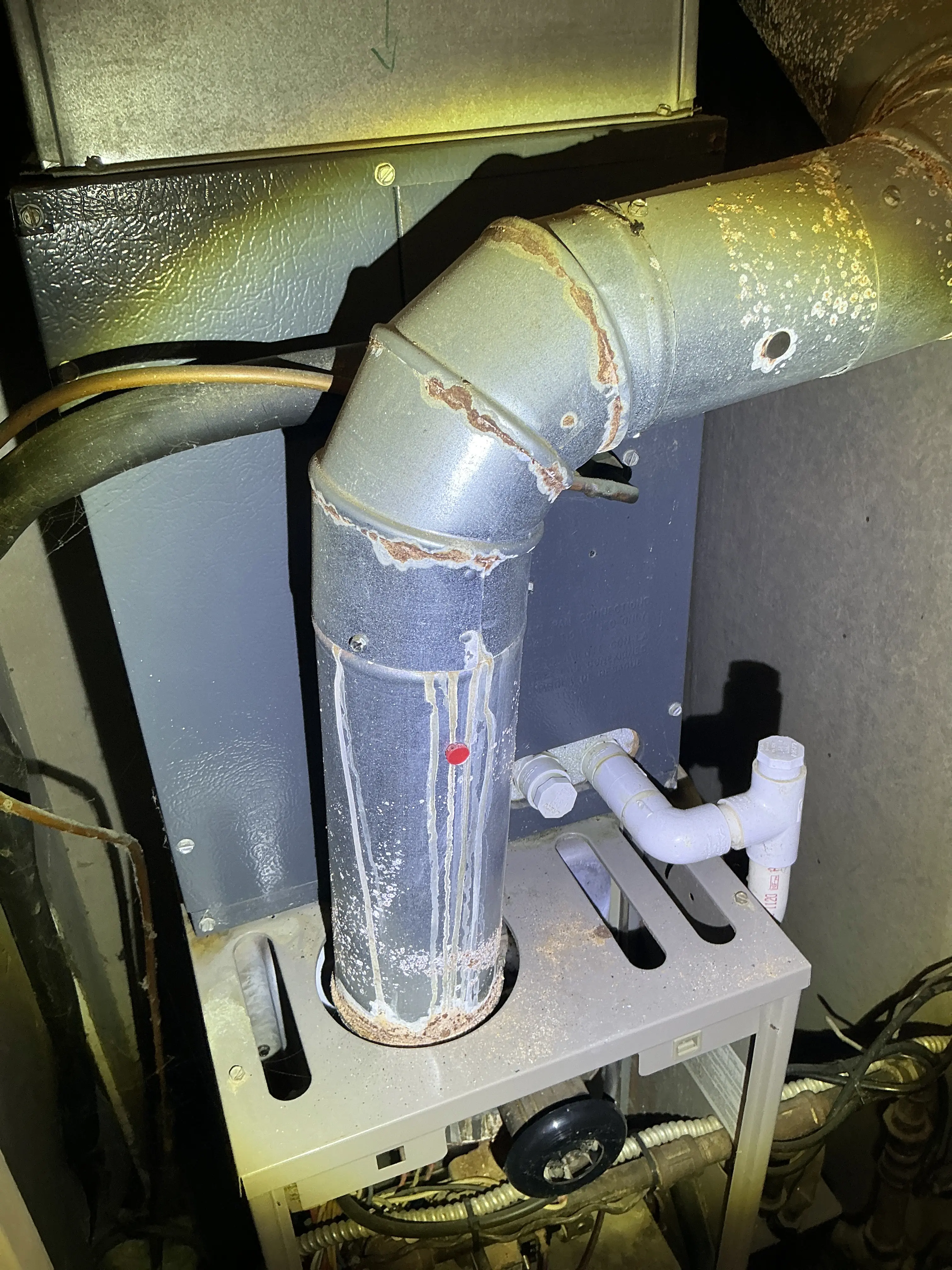 Rust and corrosion visible on a metal furnace flue pipe during a general inspection 2026-07-05
