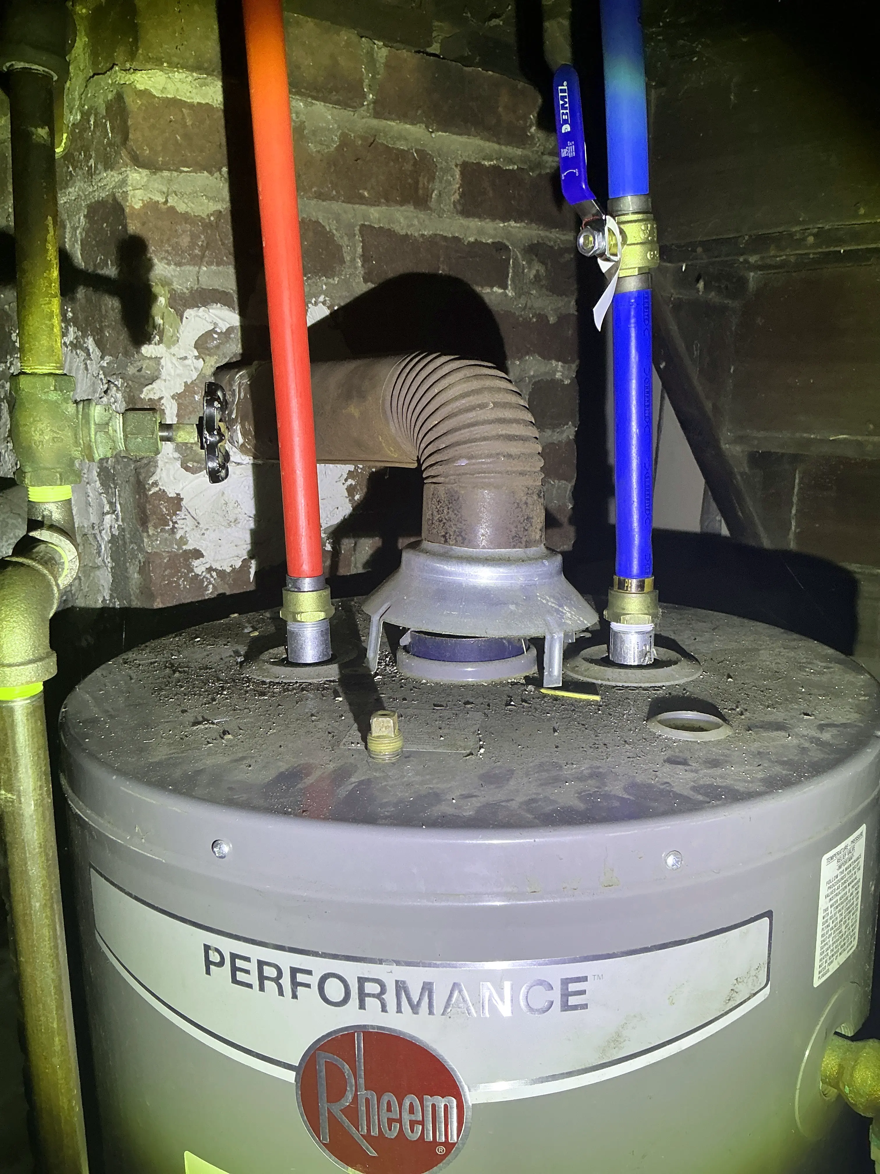 Gas water heater with disconnected flue draft hood and improper PEX pipe connections 2026-07-21