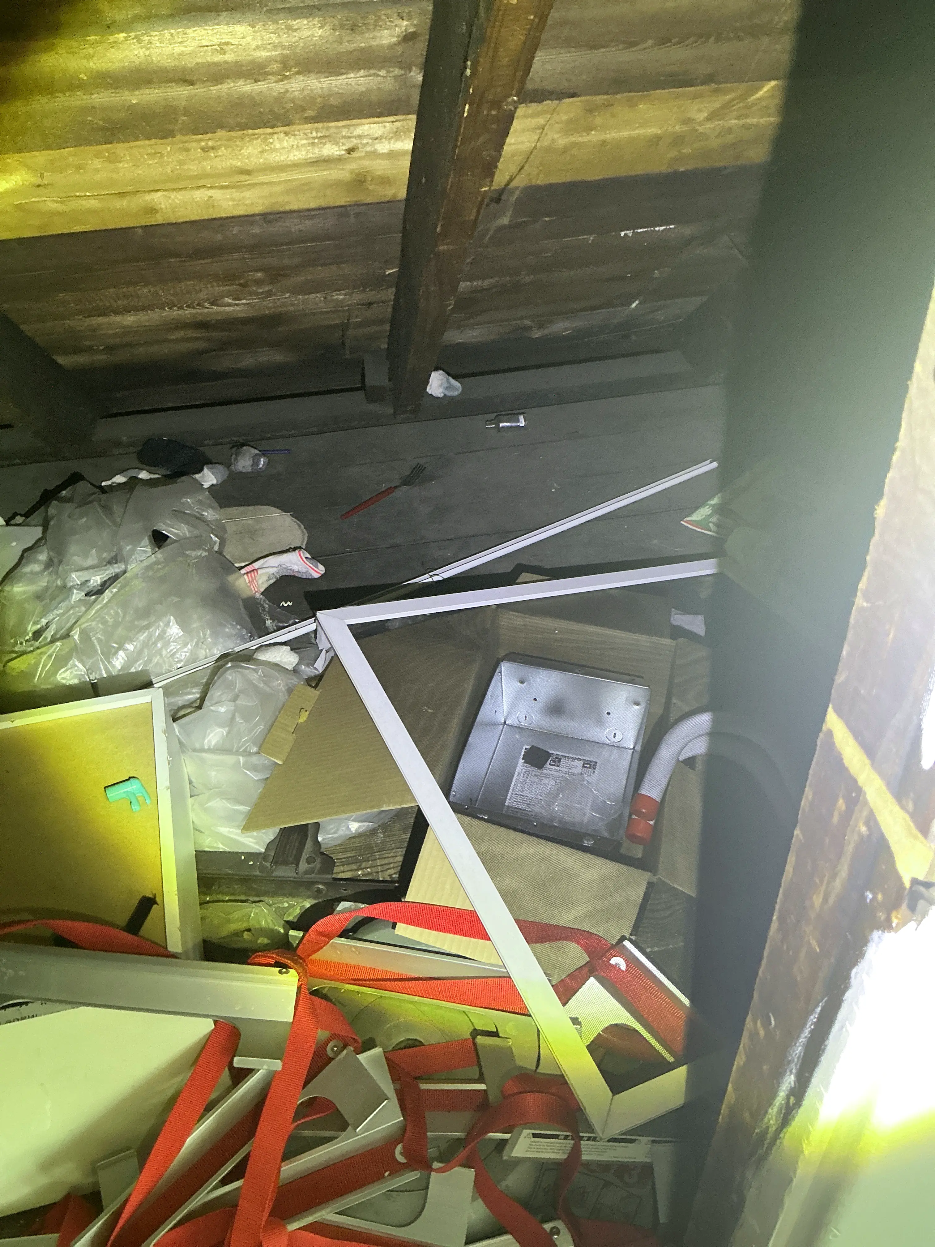 Excessive clutter and construction debris accumulated in an attic space 2026-07-10