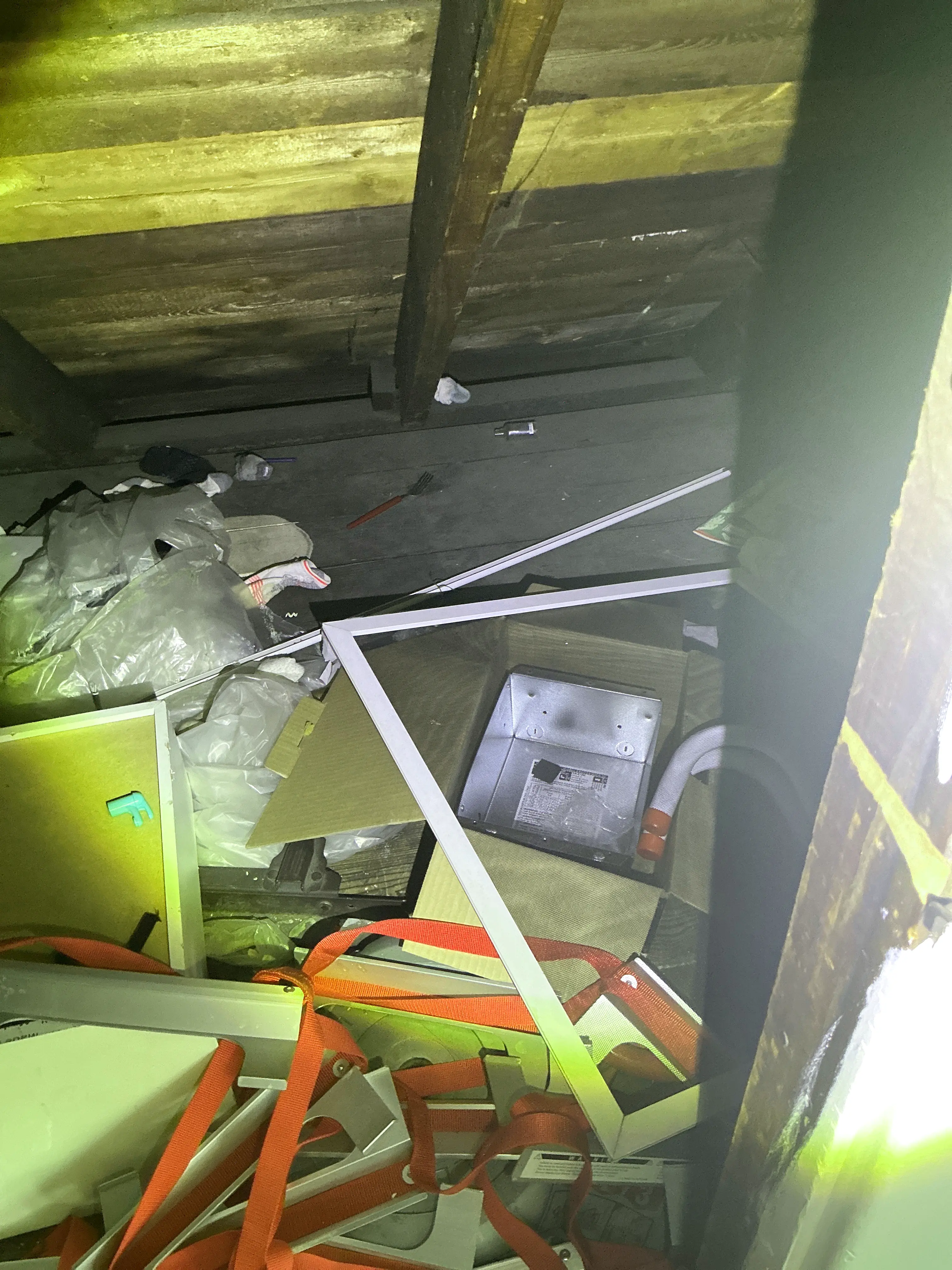 Excessive clutter and construction debris accumulated in an attic space 2026-08-15