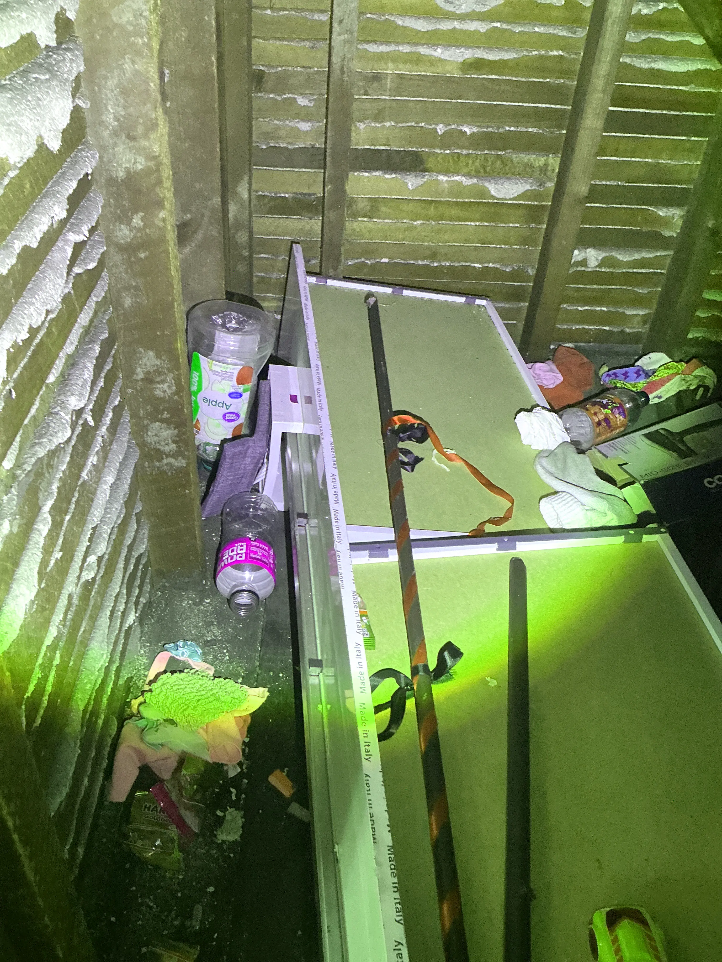 Accumulated clutter and trash debris inside an attic space during mold testing 2026-07-23