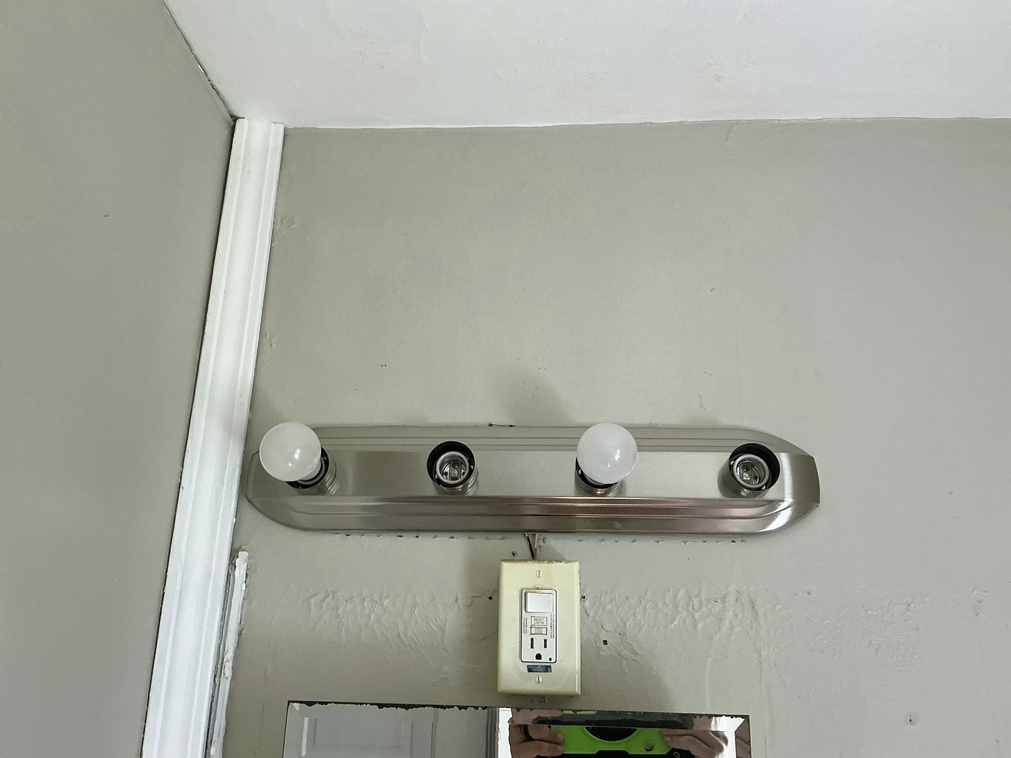 Vanity light fixture missing light bulbs above bathroom mirror 2026-07-30