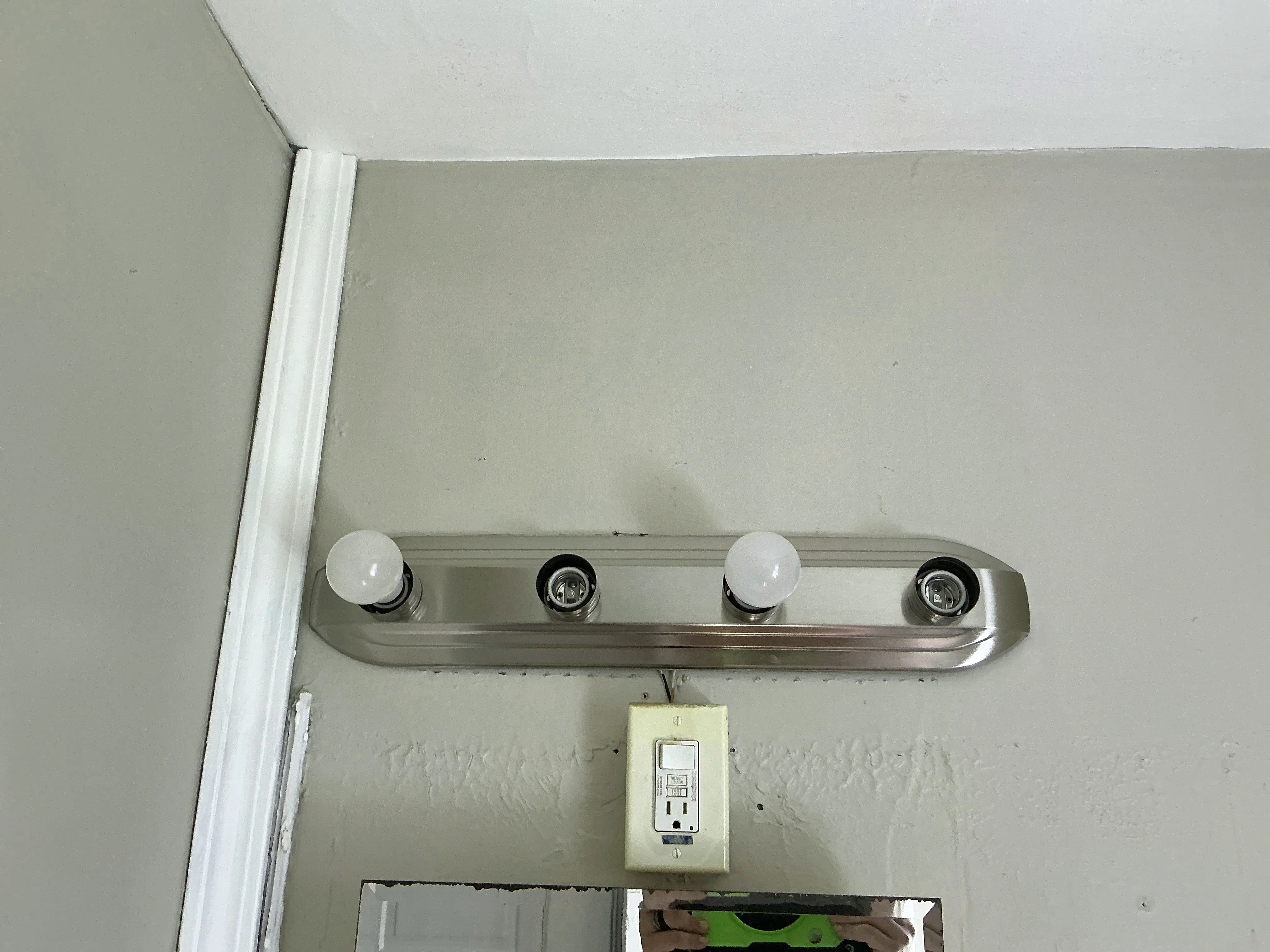 Vanity light fixture missing light bulbs above bathroom mirror 2026-08-17