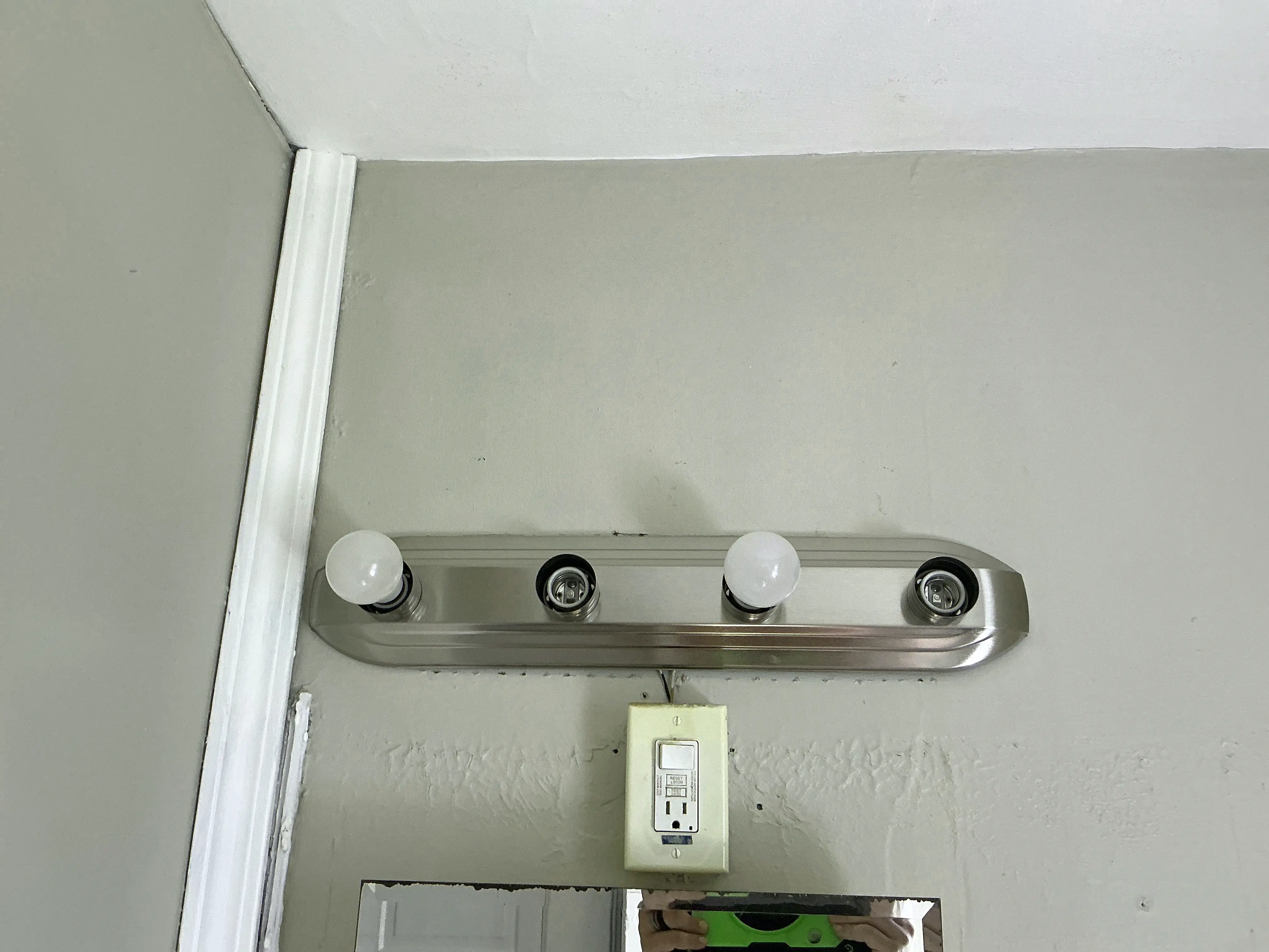 Vanity light fixture missing light bulbs above bathroom mirror 2026-08-17