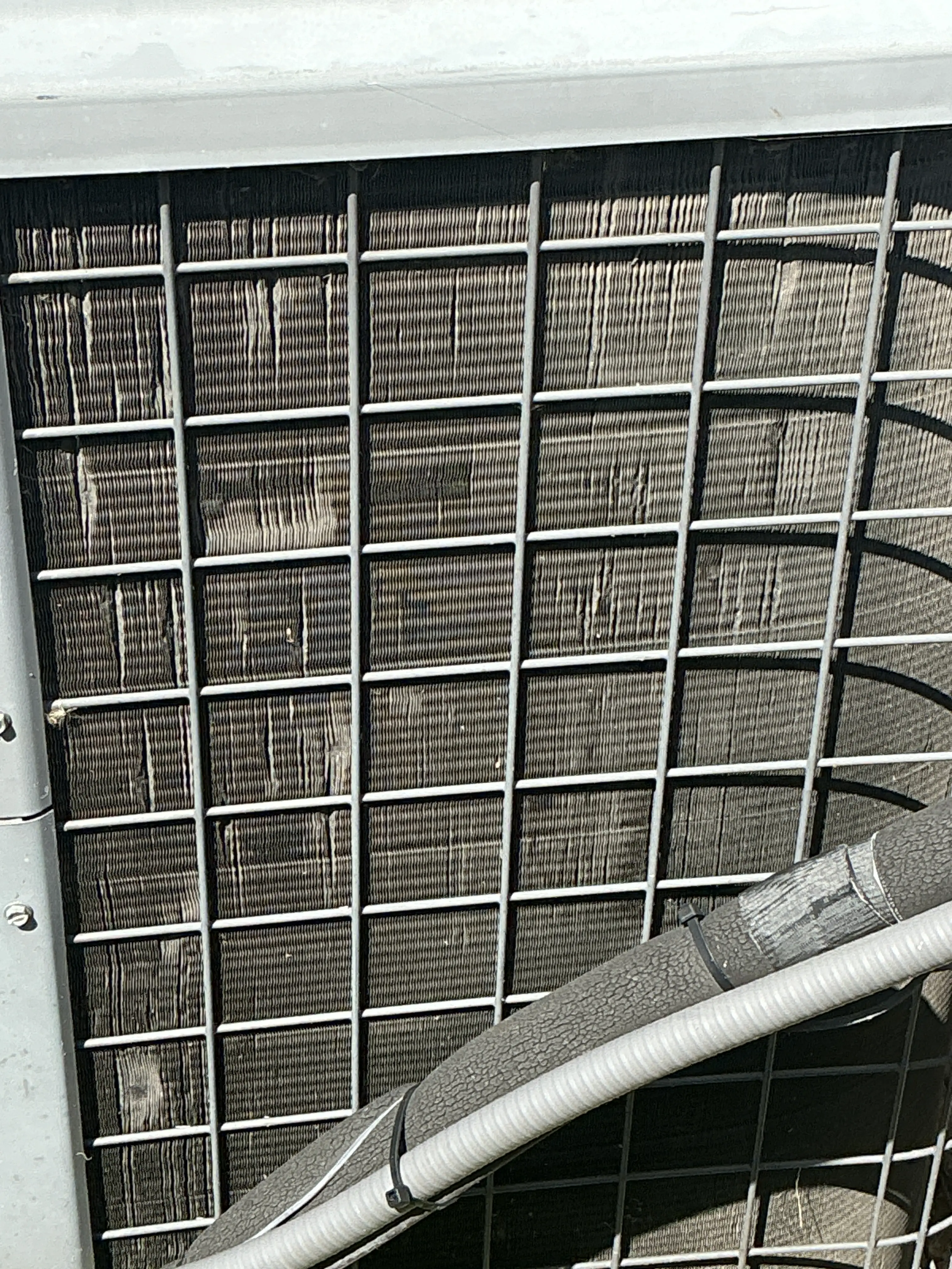 Bent fins on an outdoor air conditioning condenser coil 2026-07-31