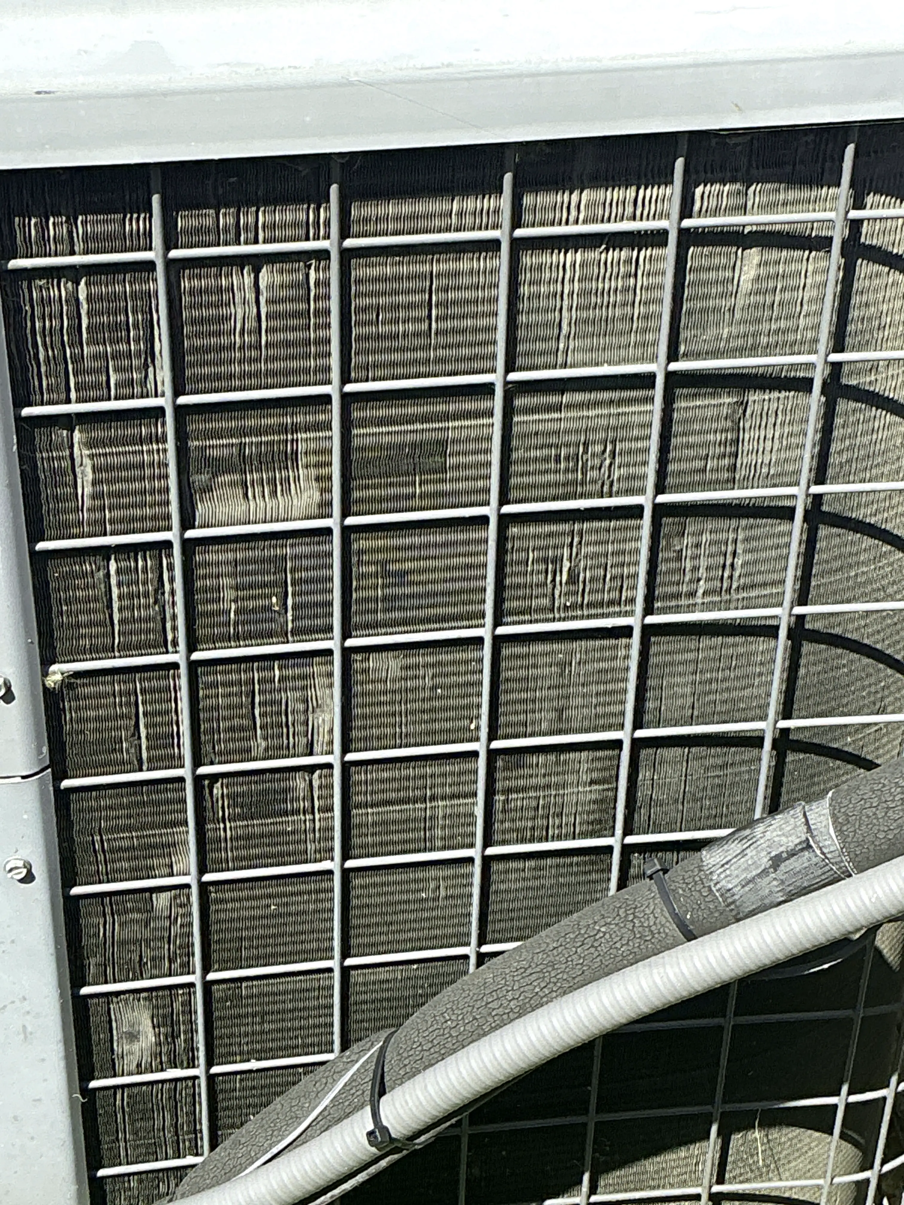 Bent fins on an outdoor air conditioning condenser coil 2026-07-31