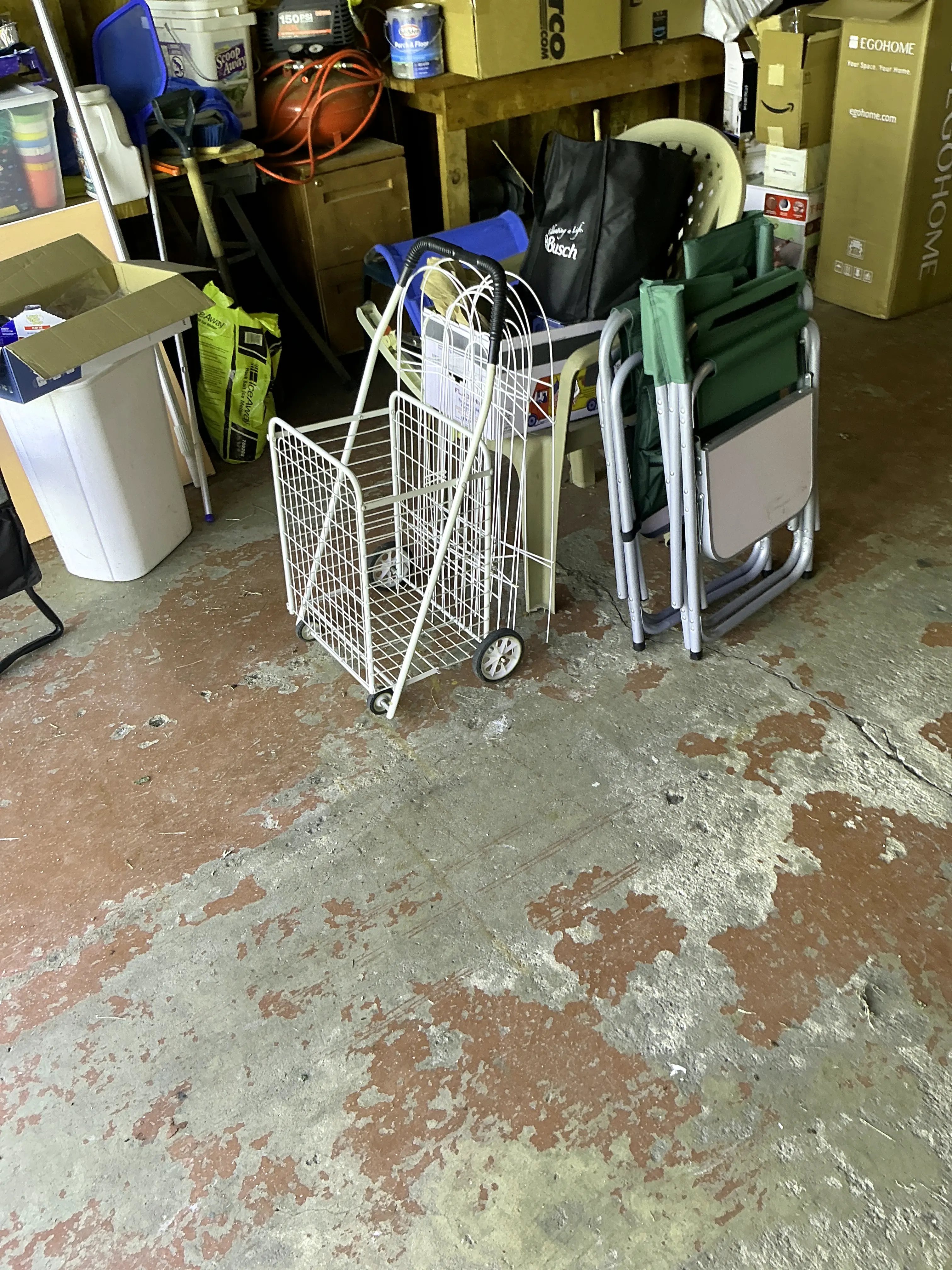Peeling red paint coating on garage concrete floor 2026-07-18
