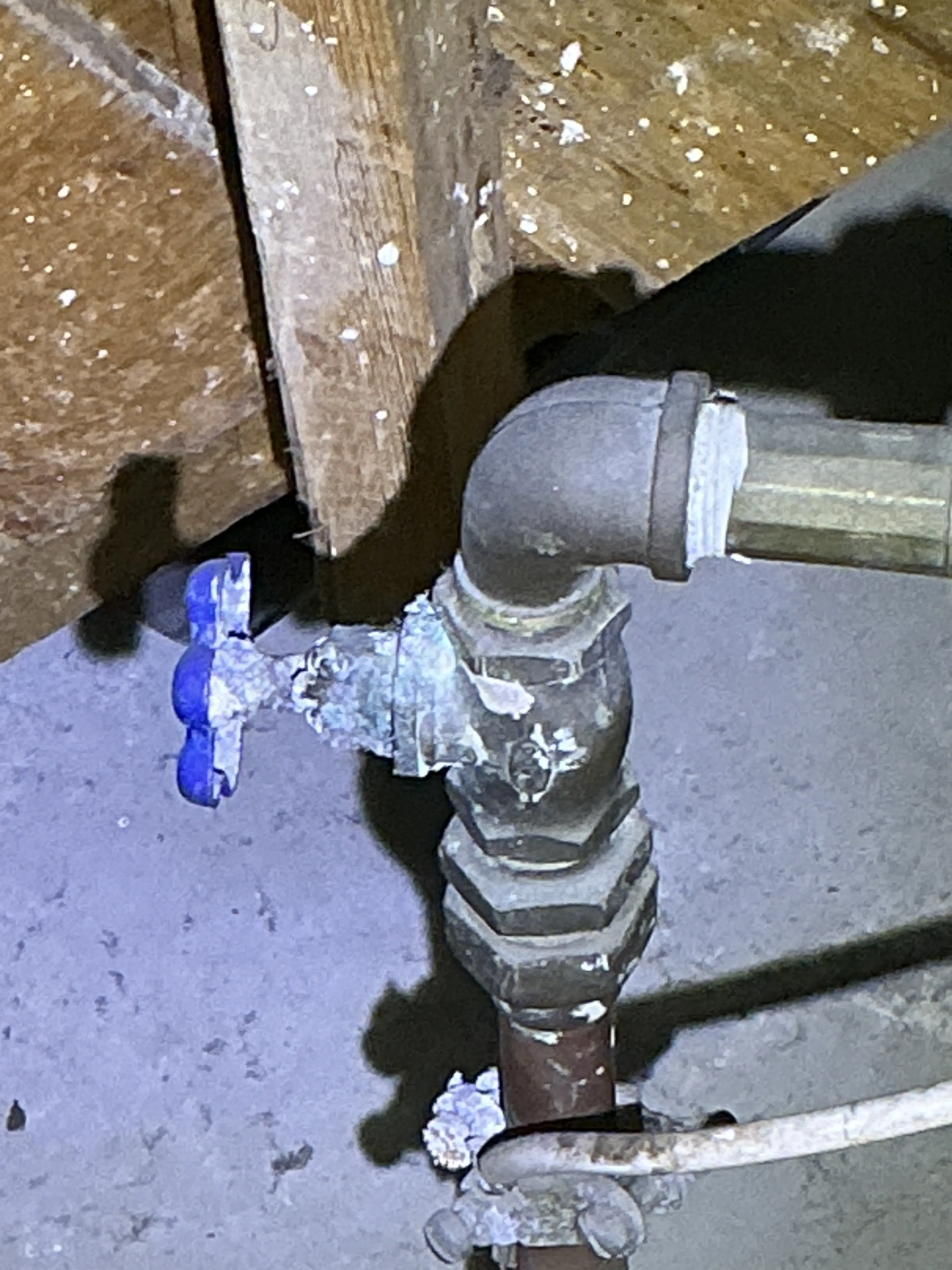 Corroded plumbing shut-off valve with heavy white mineral buildup 2026-07-13