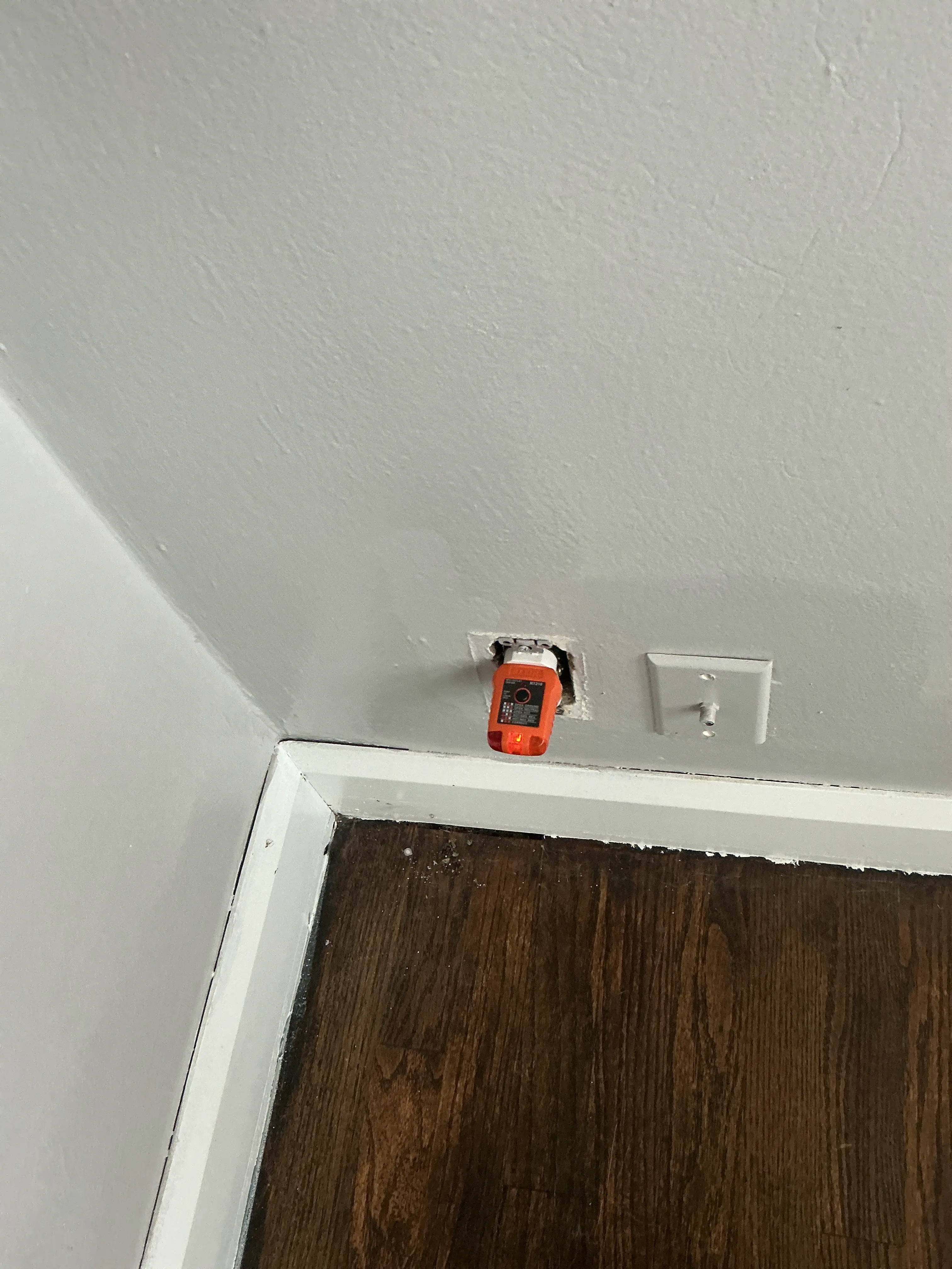 Unfinished electrical outlet missing cover plate during general inspection 2026-08-03