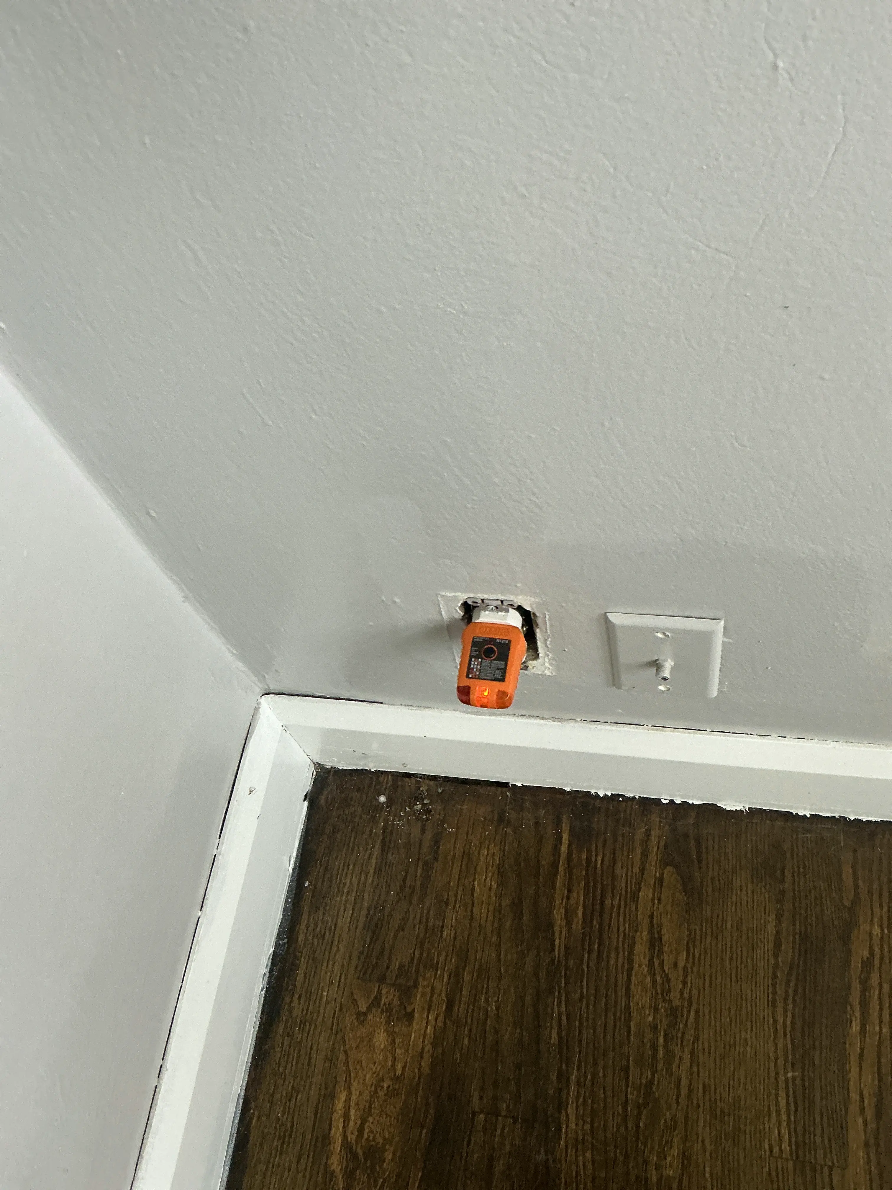 Unfinished electrical outlet missing cover plate during home inspection 2026-07-24
