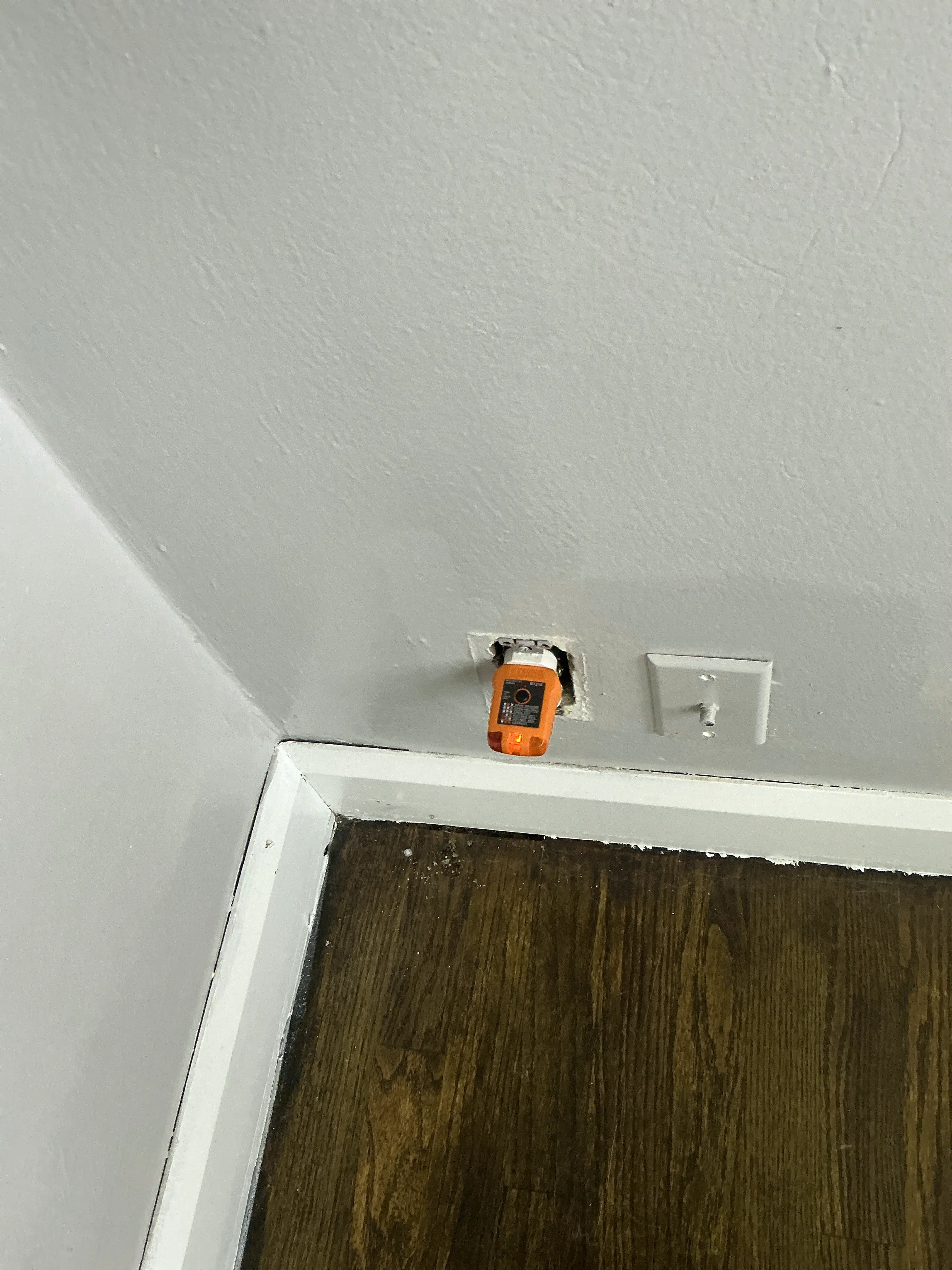 Unfinished electrical outlet missing cover plate during mold inspection 2026-07-27