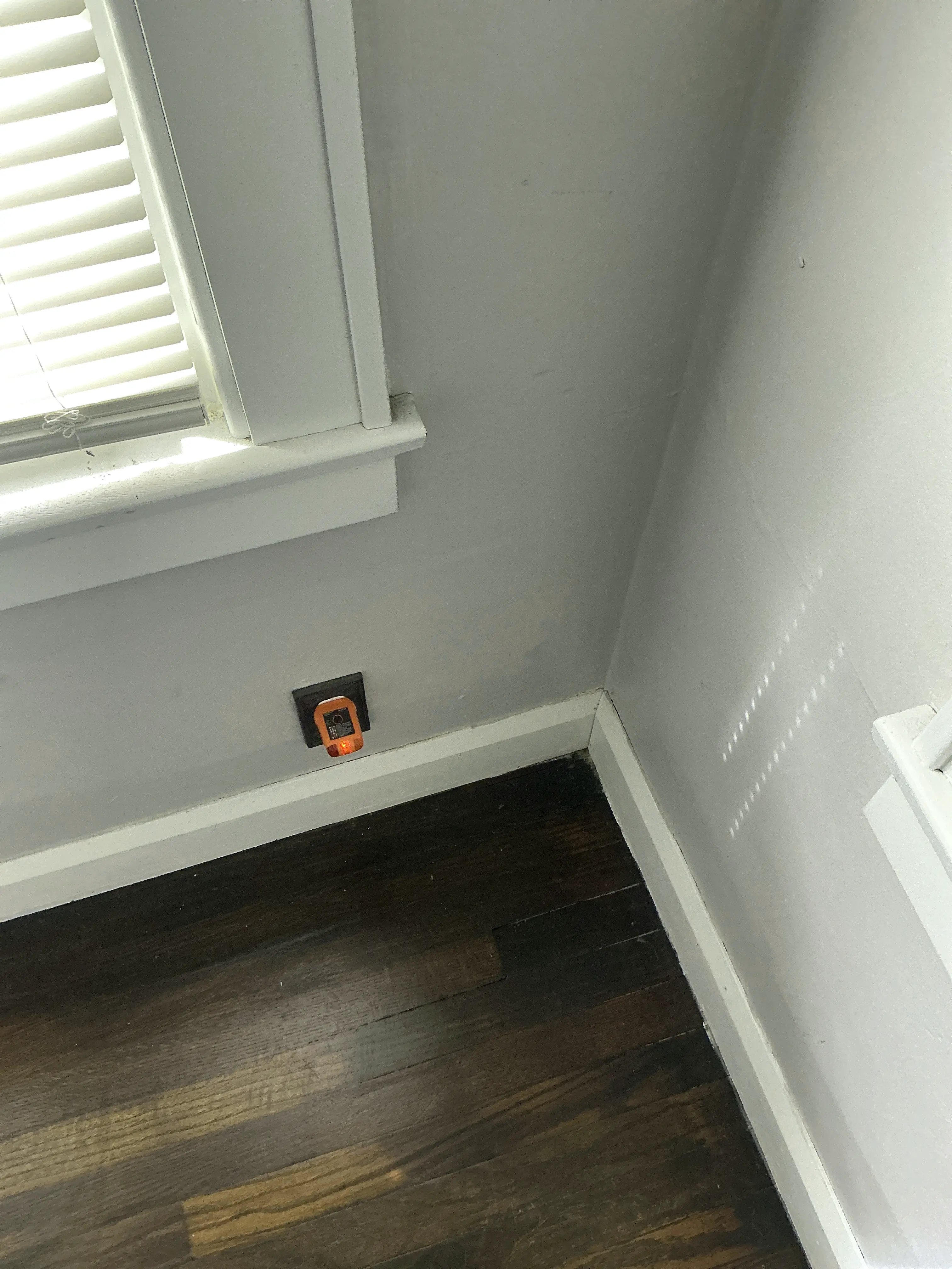 Circuit tester plugged into a wall outlet during a home electrical inspection 2026-07-29