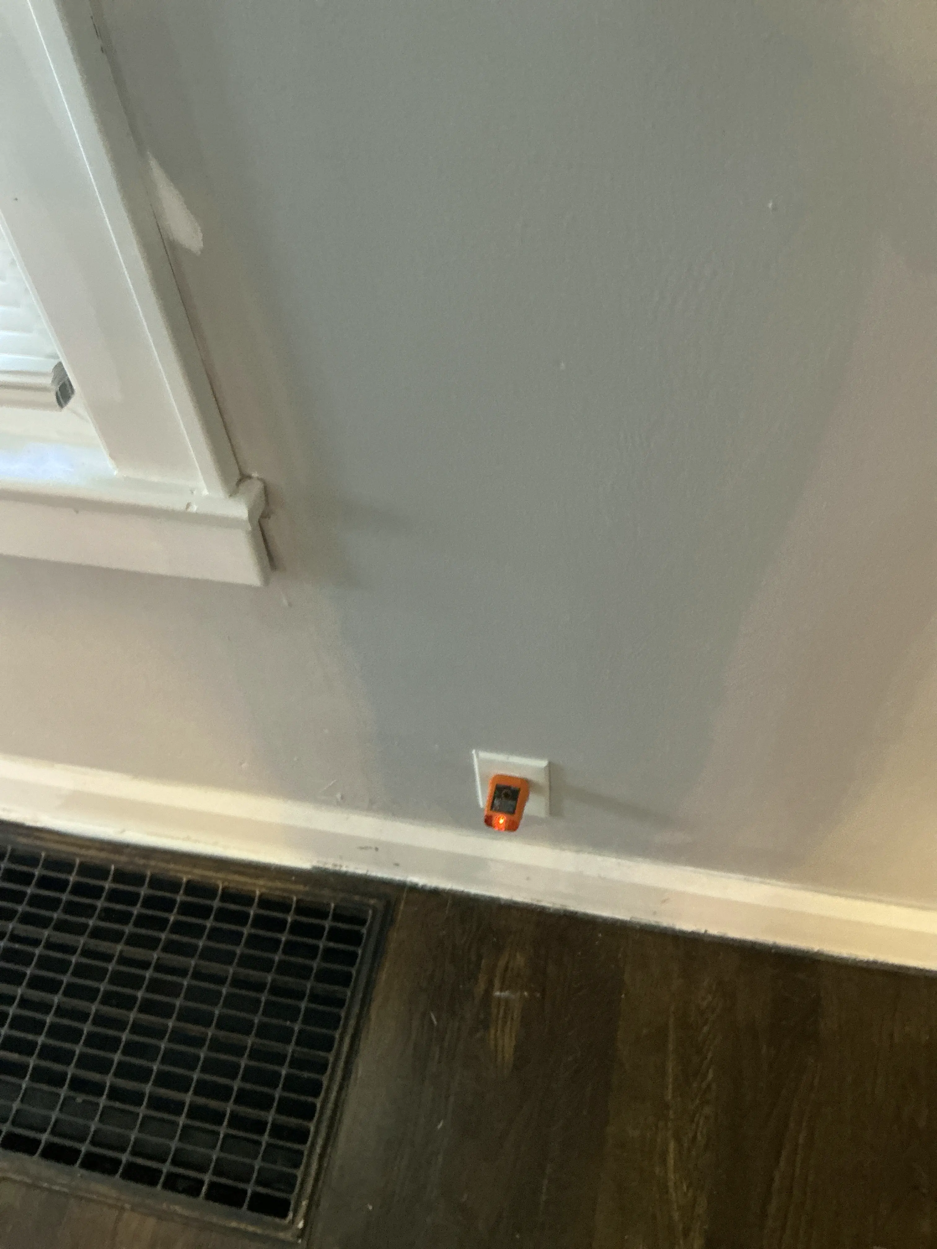 Circuit tester plugged into a wall outlet during a mold testing 2026-07-30