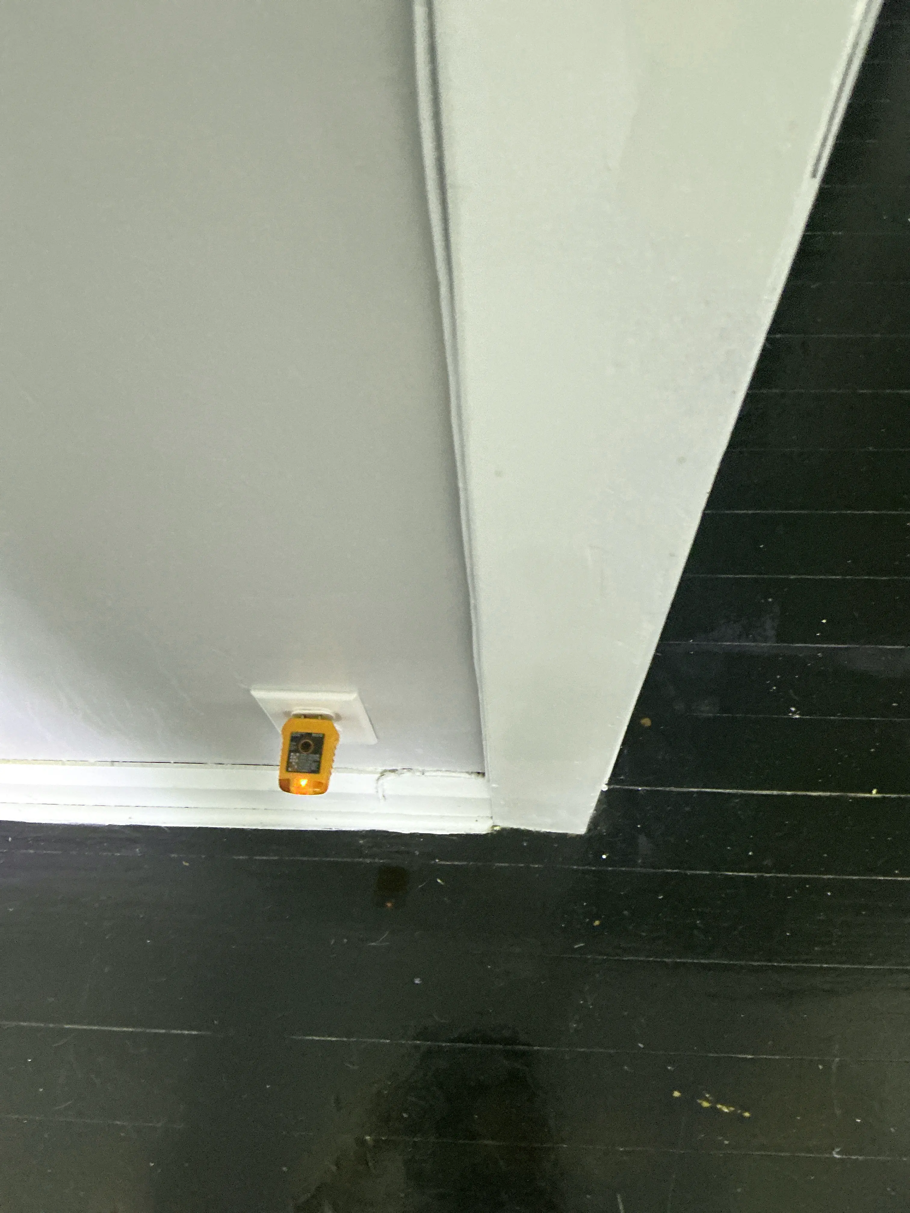 Home inspector testing an electrical outlet with an orange receptacle tester 2026-07-19