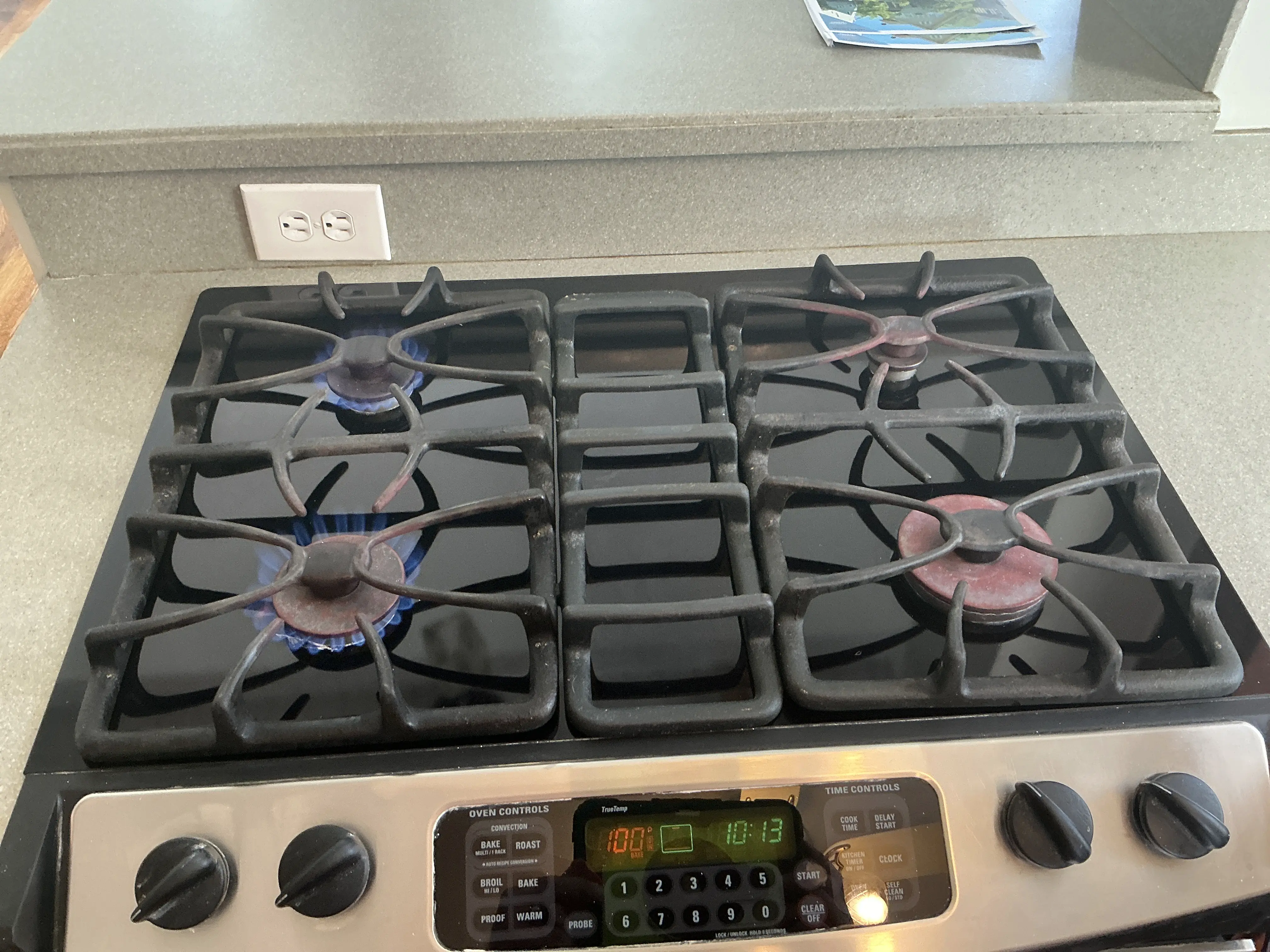 Gas cooktop burners being tested during a residential mold inspection 2026-07-13